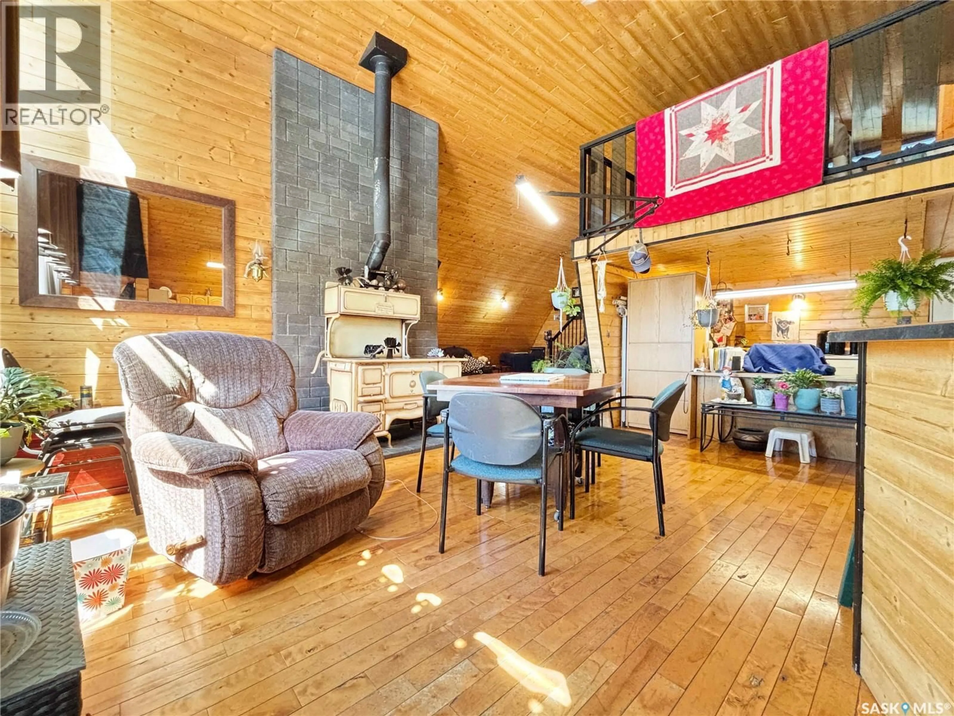 Living room with furniture, wood/laminate floor for STRUNK ACREAGE, Dundurn Rm No. 314 Saskatchewan S7K1M2