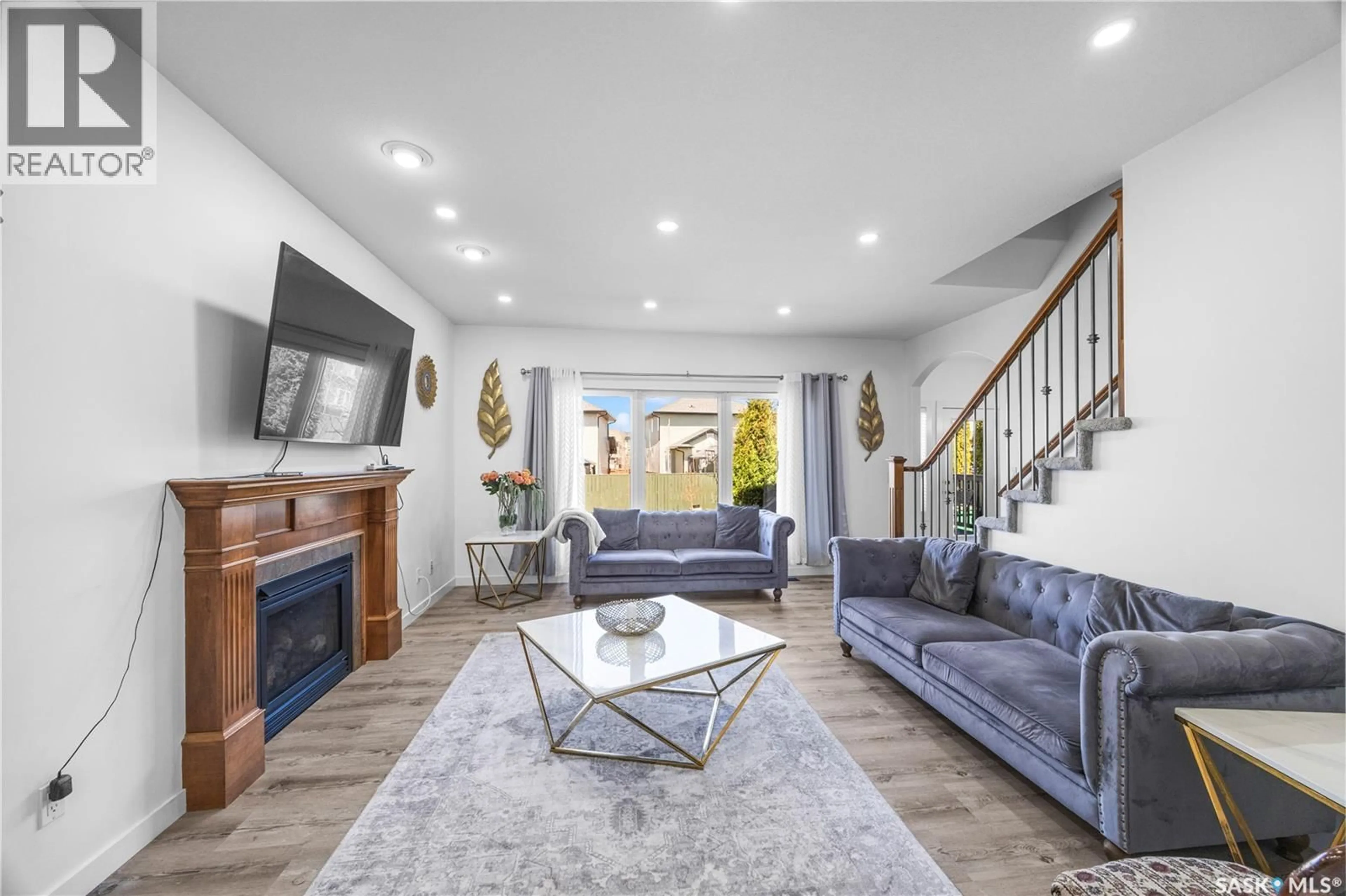 Living room with furniture, ceramic/tile floor for 222 STEPNEY CRESCENT, Saskatoon Saskatchewan S7T0A5