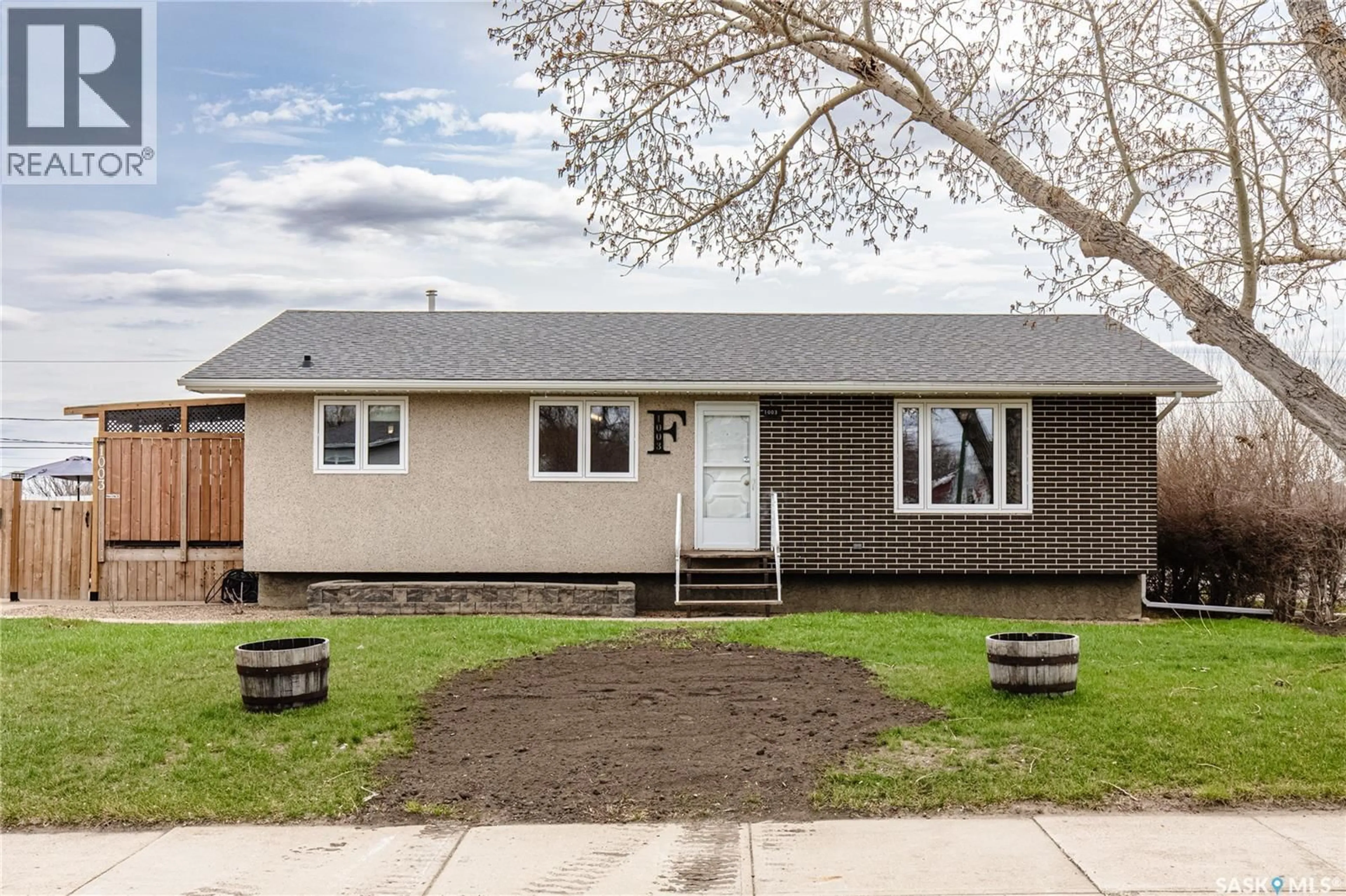 Home with vinyl exterior material, street for 1003 OMINICA STREET, Moose Jaw Saskatchewan S6H0J4
