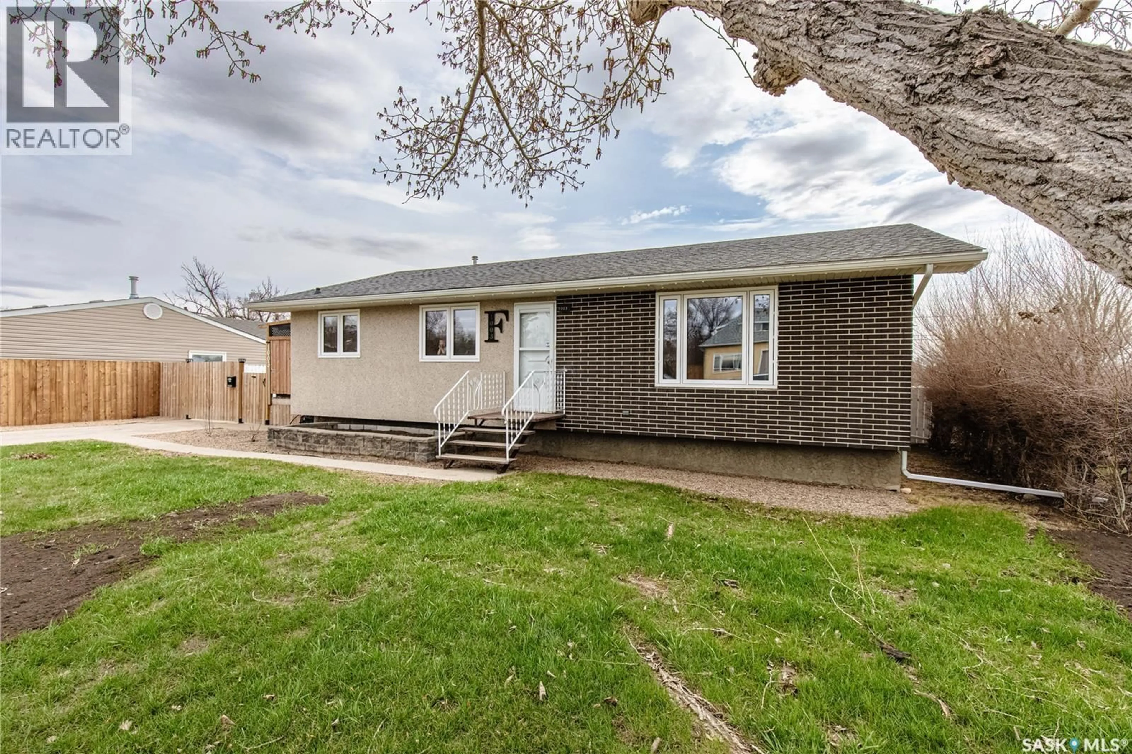 Home with vinyl exterior material, street for 1003 OMINICA STREET, Moose Jaw Saskatchewan S6H0J4