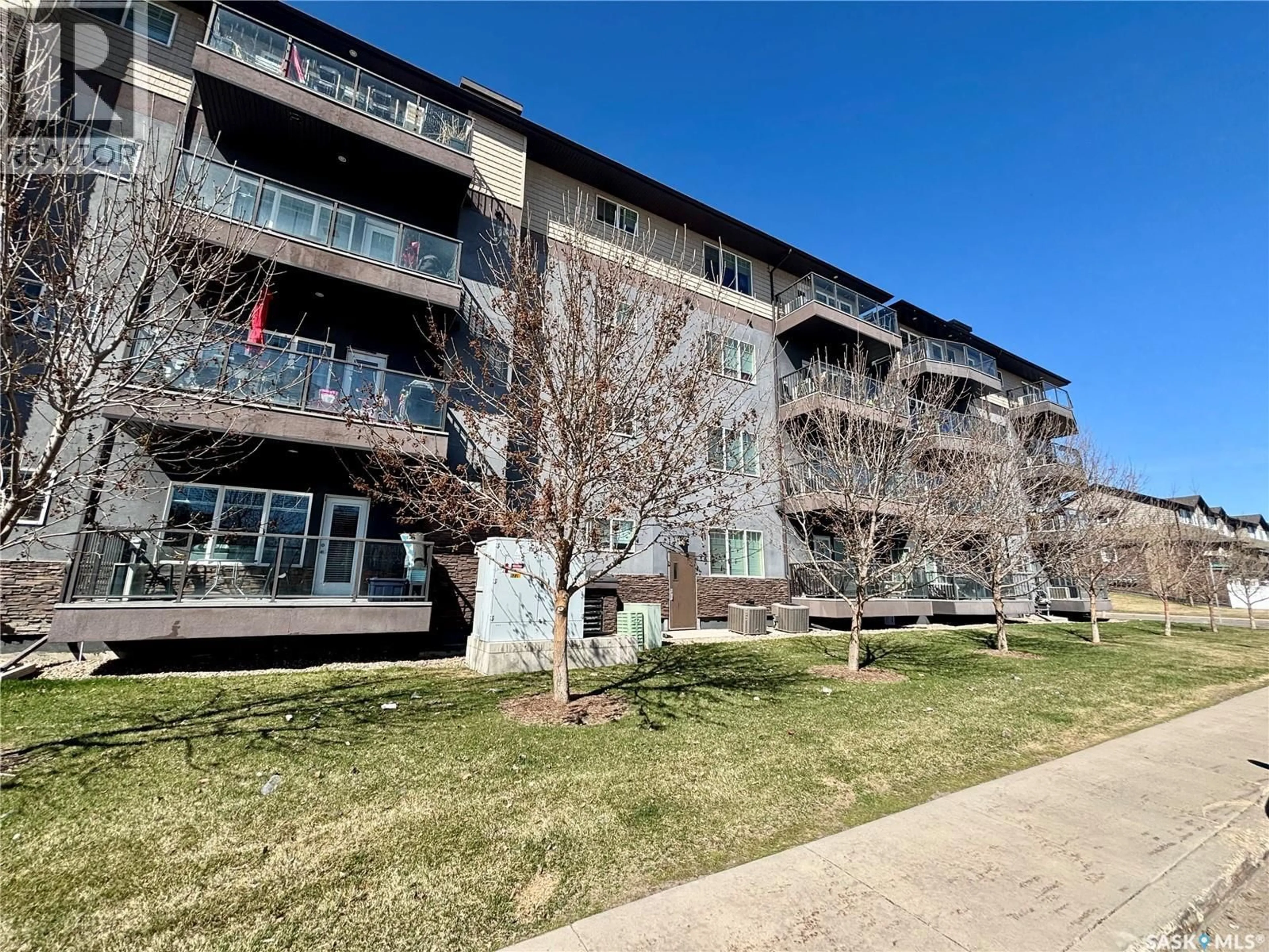 A pic from outside/outdoor area/front of a property/back of a property/a pic from drone, building for 103 - 706 HART ROAD, Saskatoon Saskatchewan S7M4L5