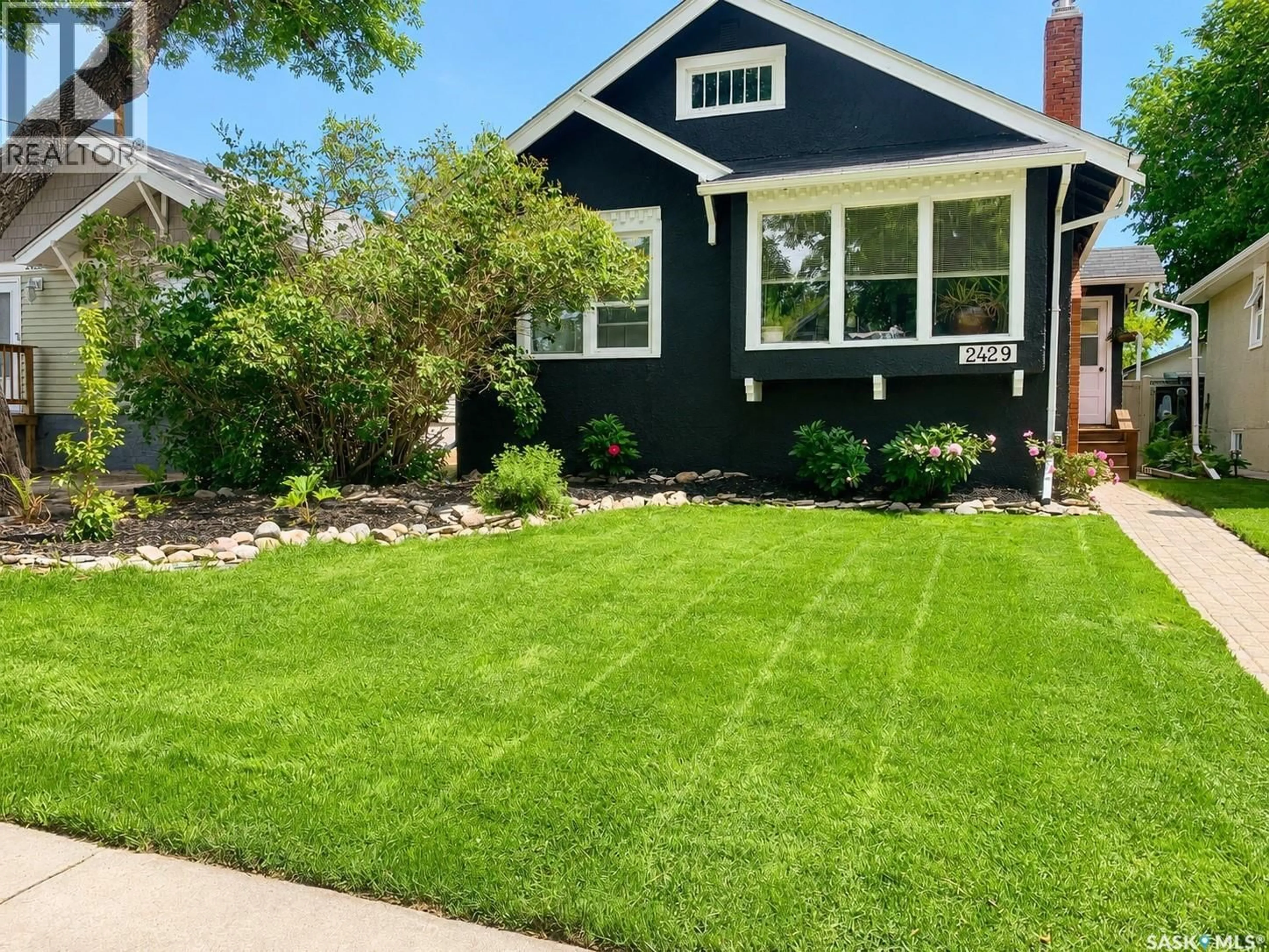 Home with vinyl exterior material, street for 2429 WALLACE STREET, Regina Saskatchewan S4N4B2