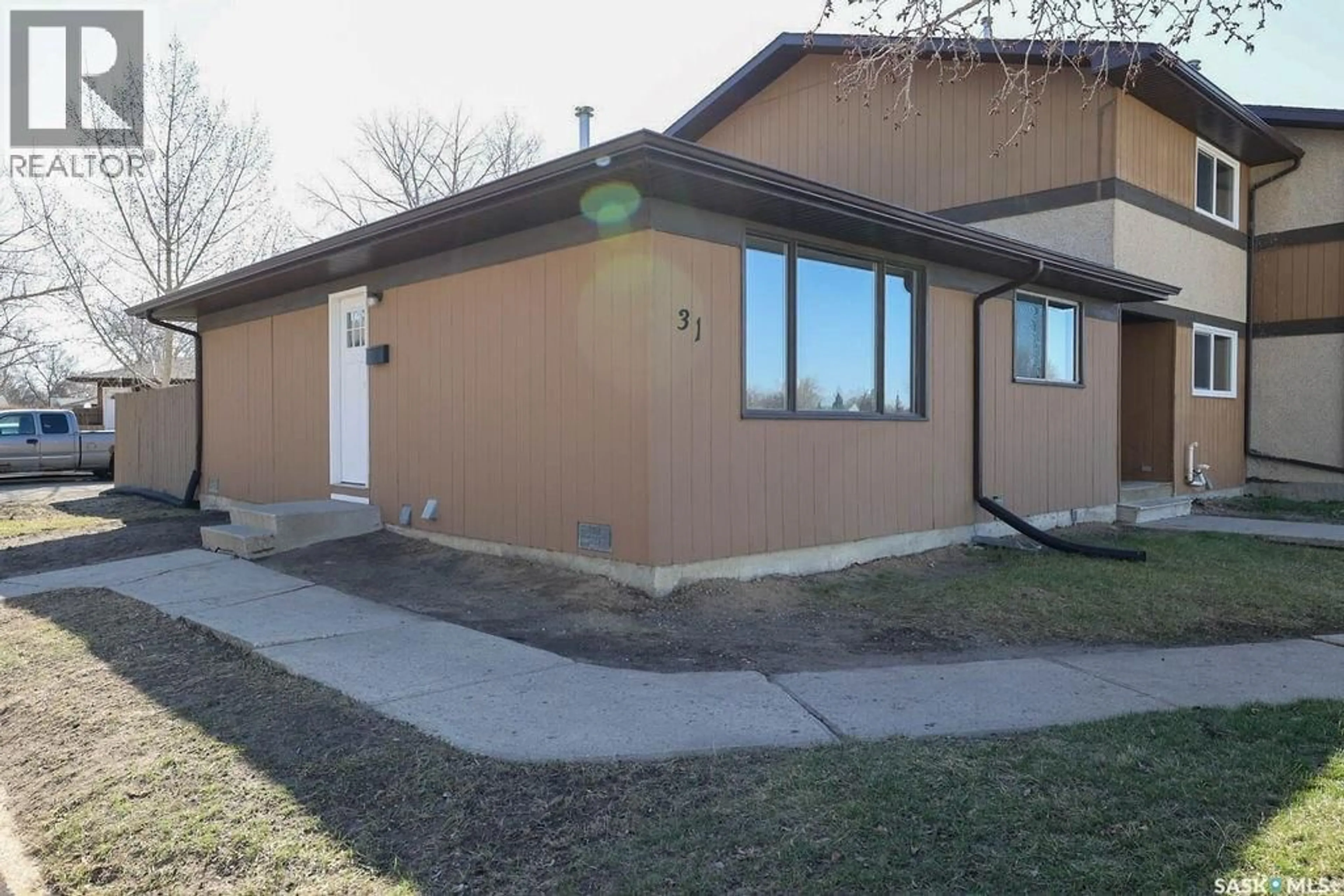 Home with vinyl exterior material, street for 31 MACKENZIE WAY, Regina Saskatchewan S4N5M7