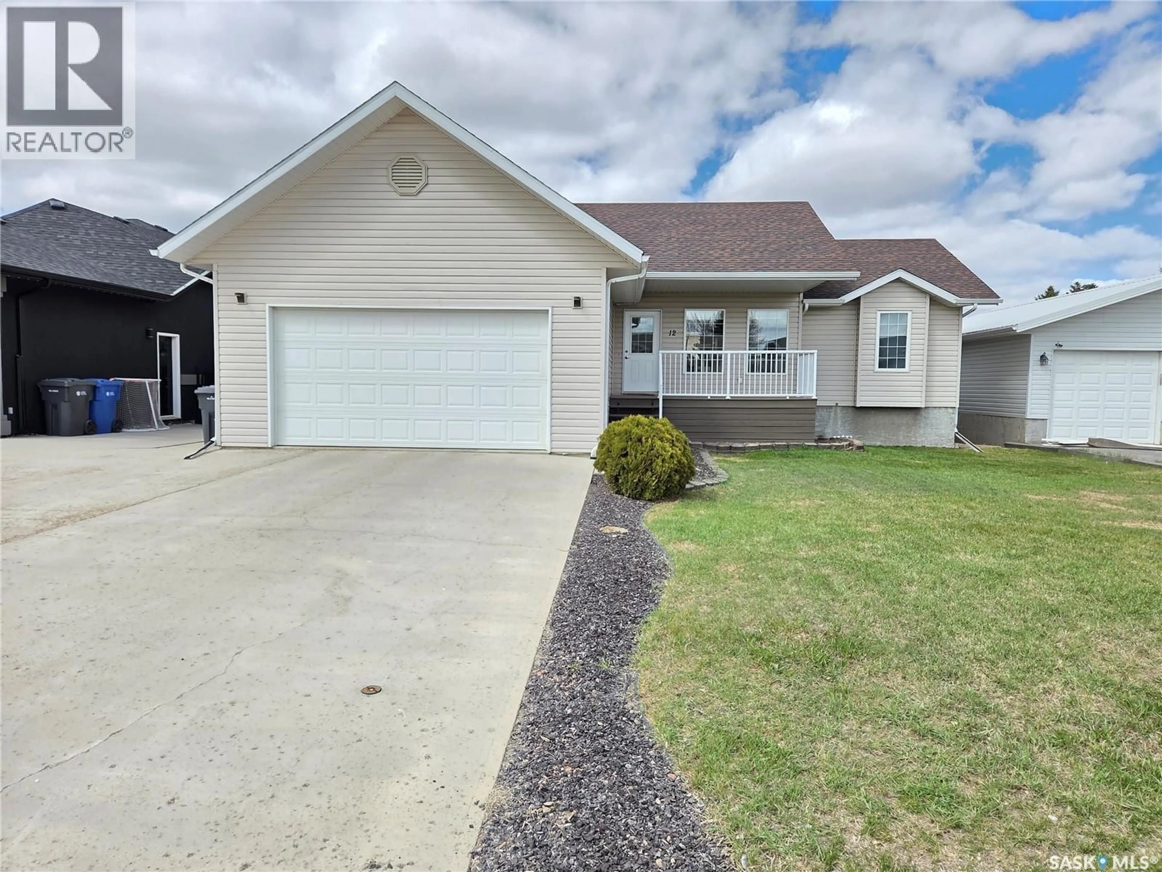 Home with vinyl exterior material, street for 12 ARCOLA PLACE, Carlyle Saskatchewan S0C0R0