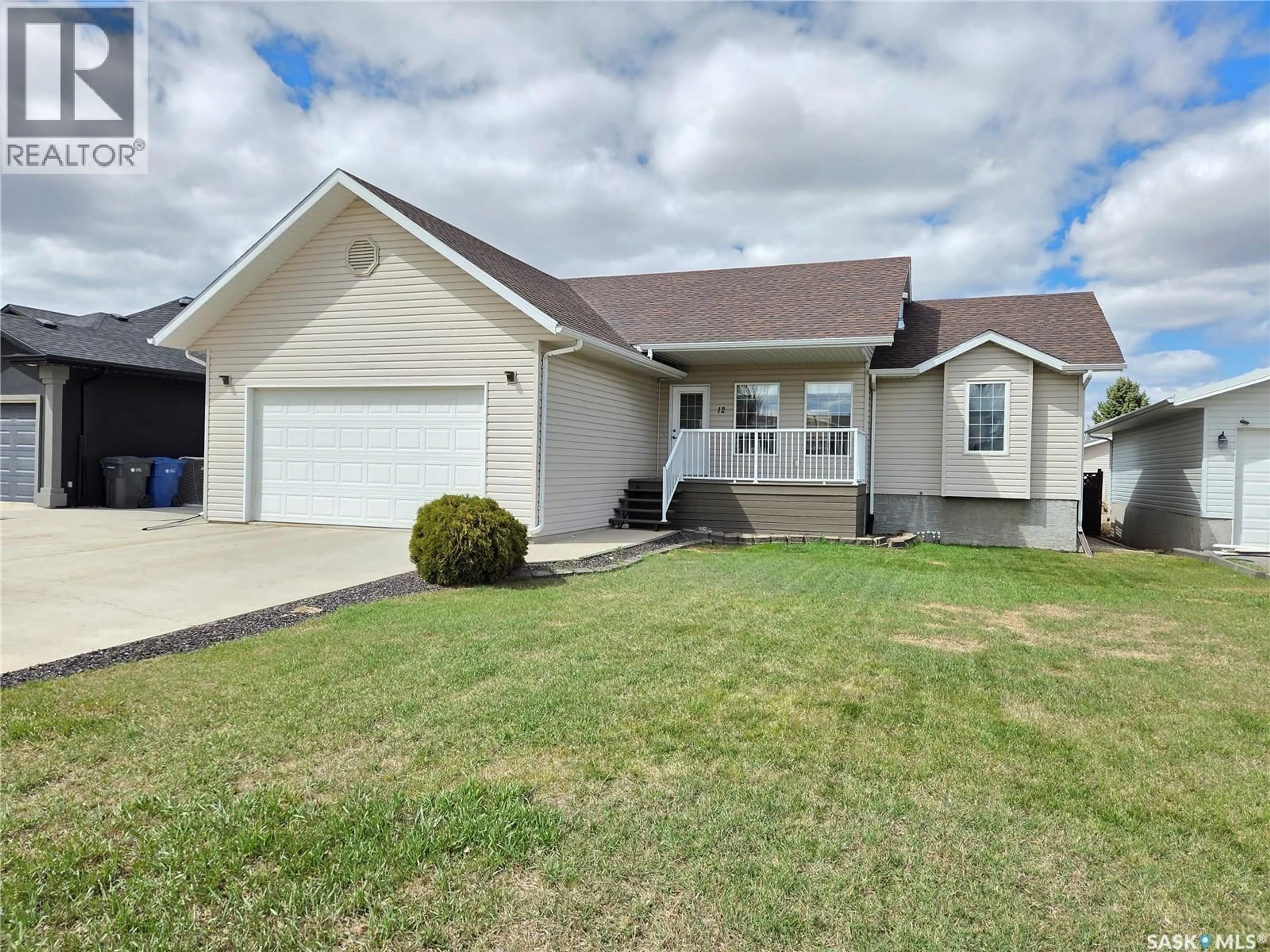 Home with vinyl exterior material, street for 12 ARCOLA PLACE, Carlyle Saskatchewan S0C0R0