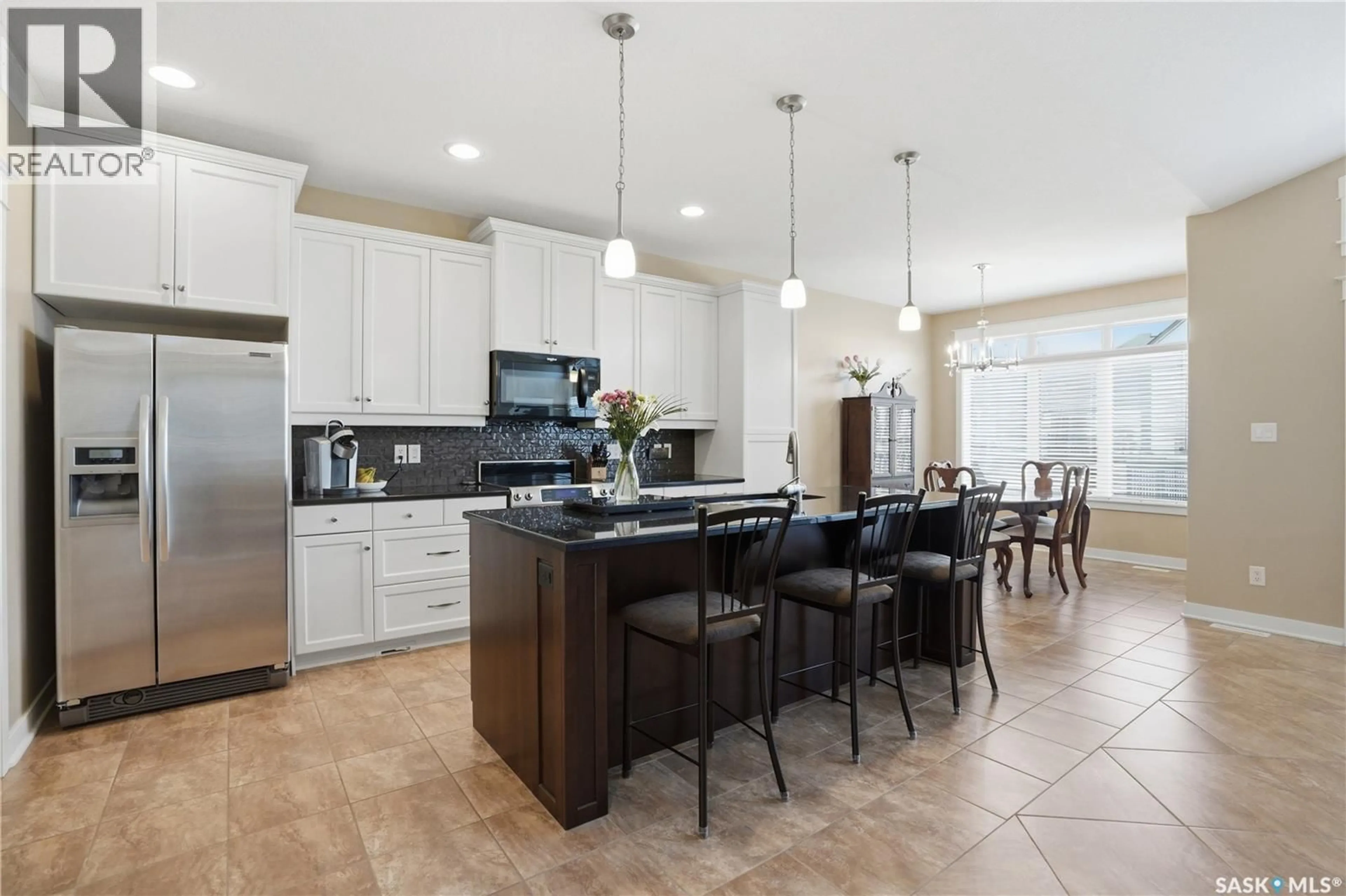 Open concept kitchen, ceramic/tile floor for 211 TRIMBLE LANE, Saskatoon Saskatchewan S7W0C9