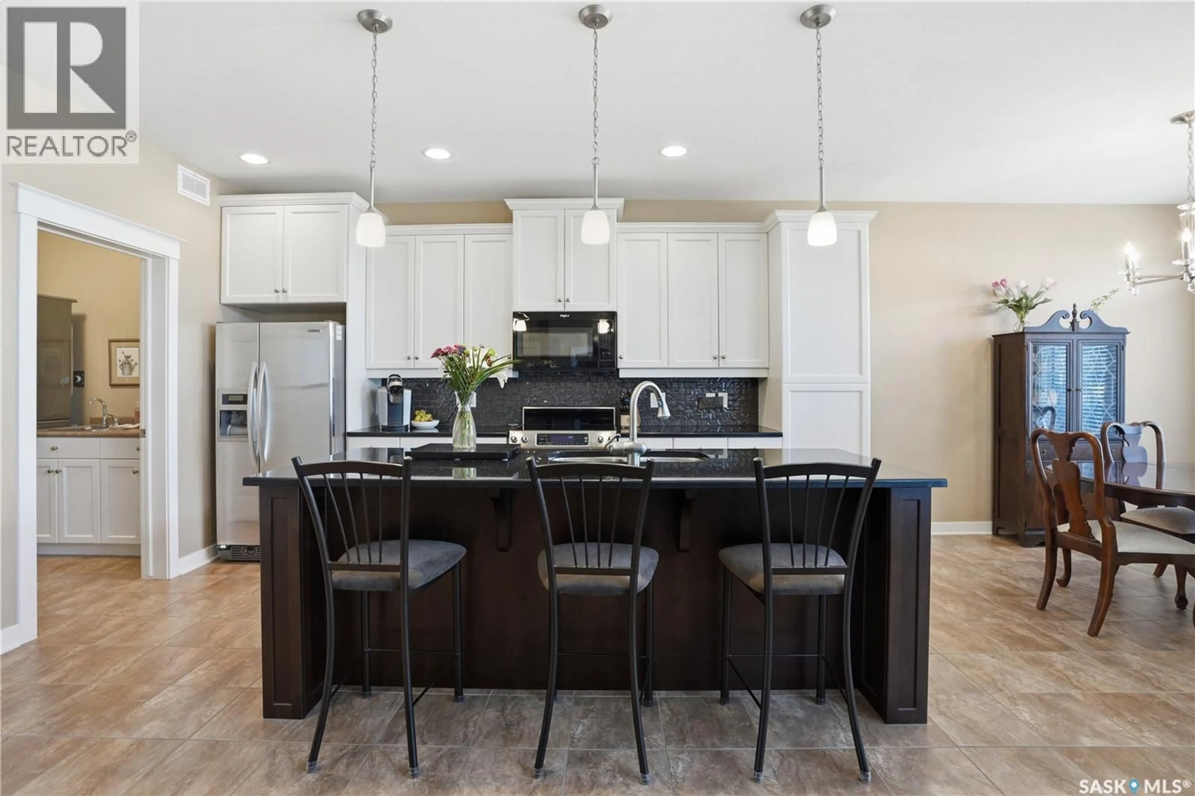 Open concept kitchen, ceramic/tile floor for 211 TRIMBLE LANE, Saskatoon Saskatchewan S7W0C9