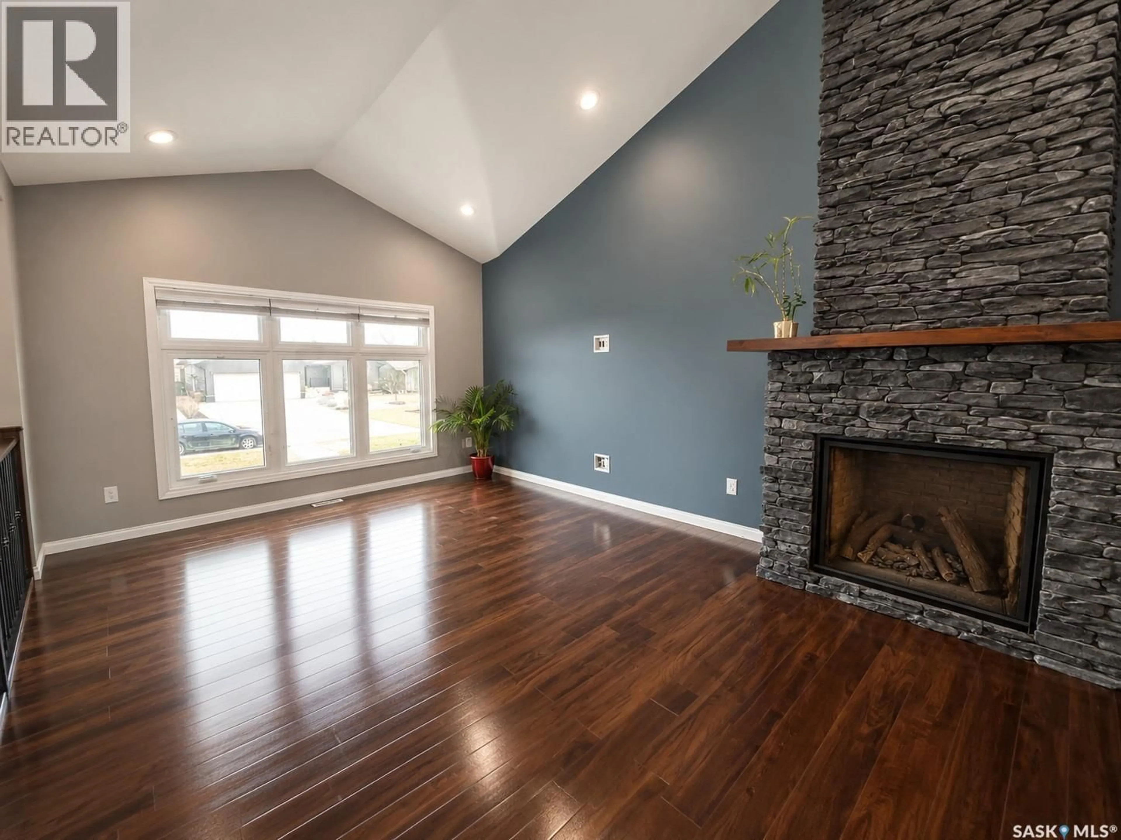 Living room with furniture, wood/laminate floor for 214 ELIZABETH STREET, Melfort Saskatchewan S0E1A0