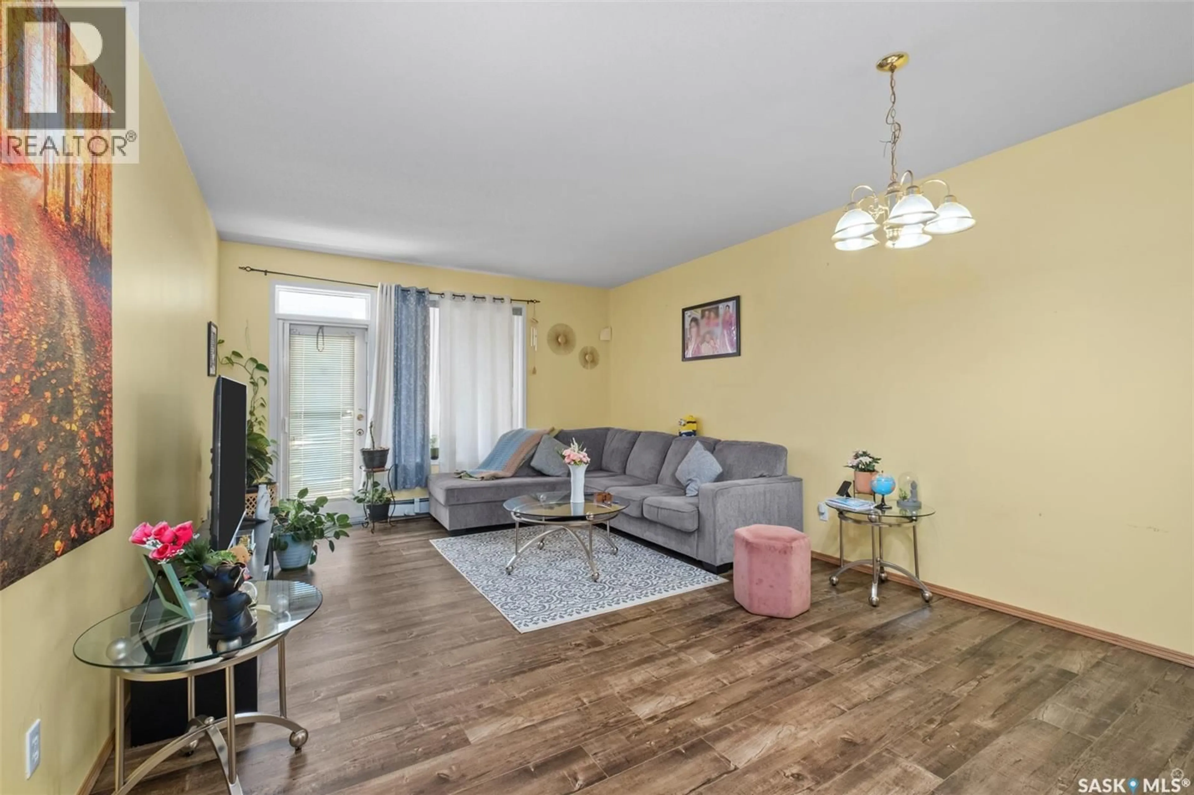 Living room with furniture, wood/laminate floor for W - 111 305 34TH STREET, Prince Albert Saskatchewan S6V8B8