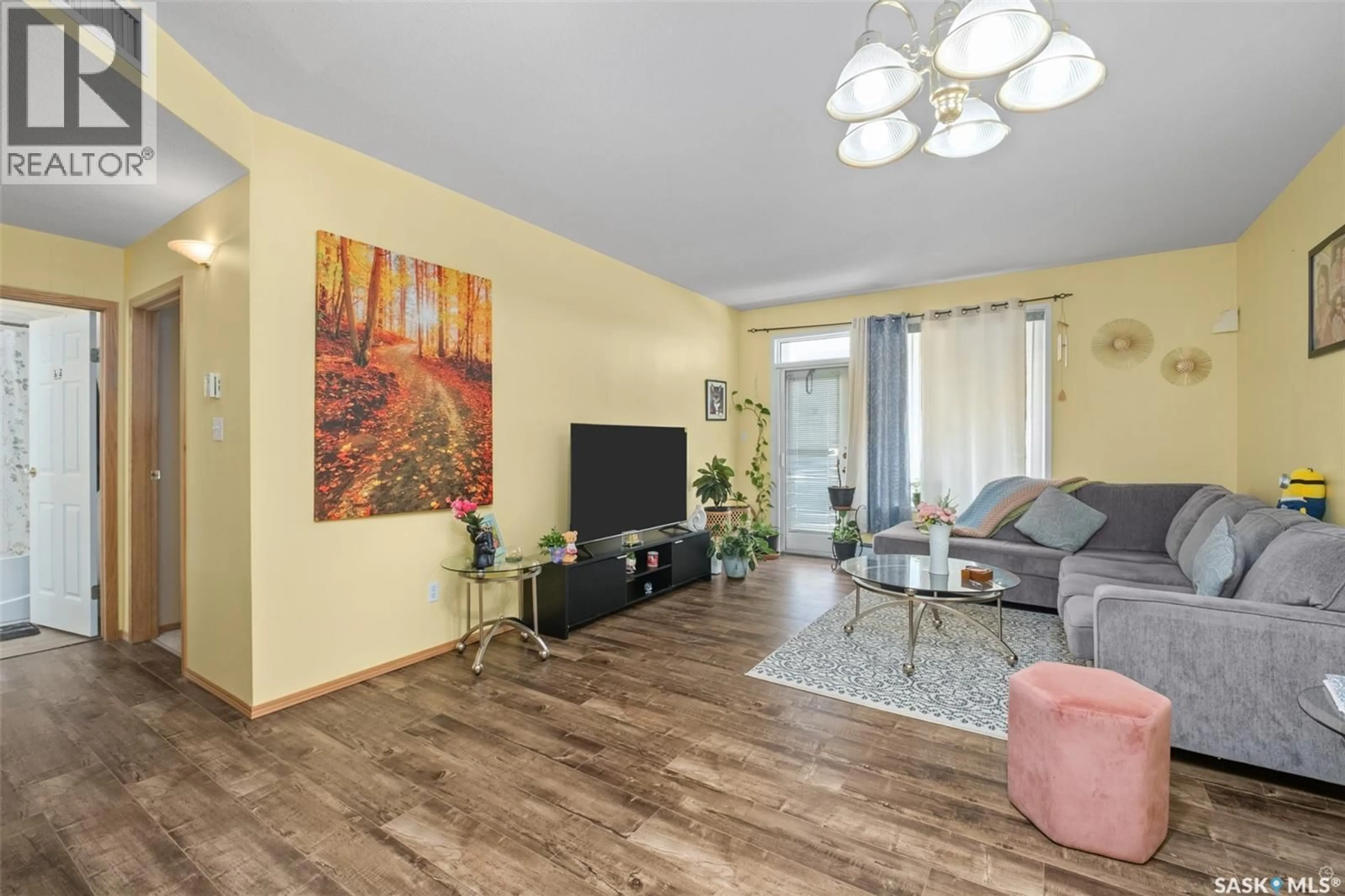 Living room with furniture, wood/laminate floor for W - 111 305 34TH STREET, Prince Albert Saskatchewan S6V8B8