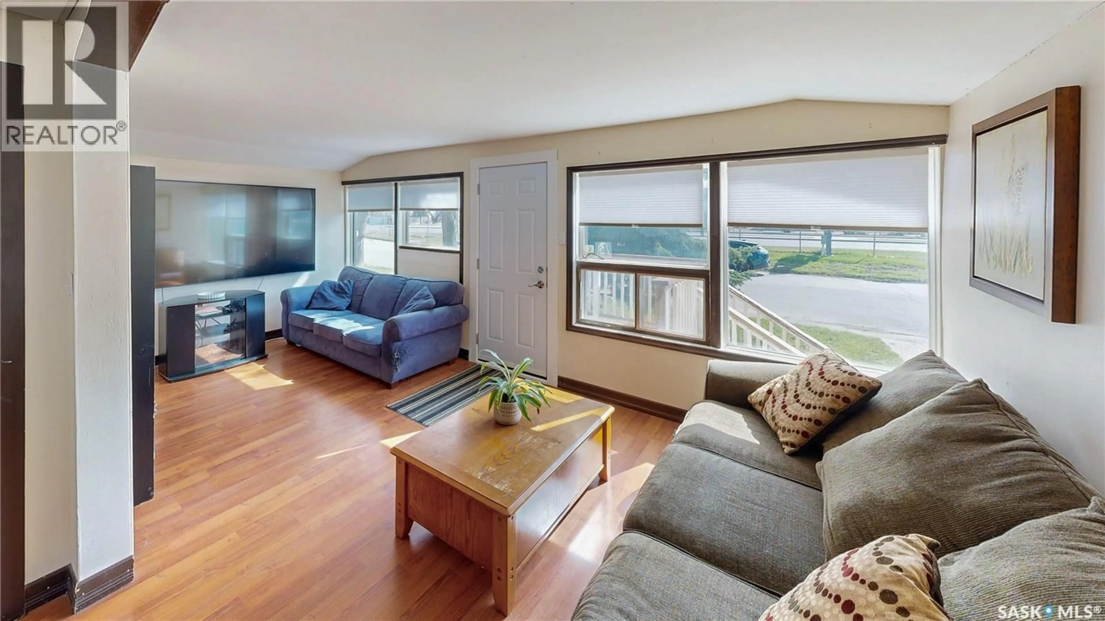 Living room with furniture, wood/laminate floor for 1330 ALEXANDRA STREET, Regina Saskatchewan S4T4N7
