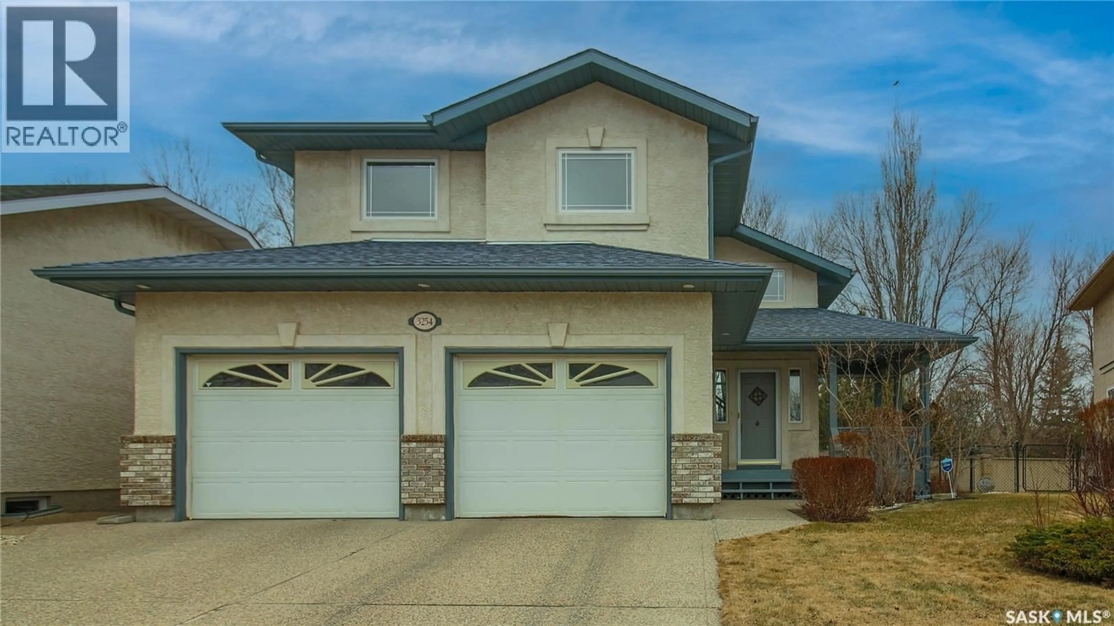 Home with vinyl exterior material, street for E - 3254 PEYSON BAY, Regina Saskatchewan S4V2W8