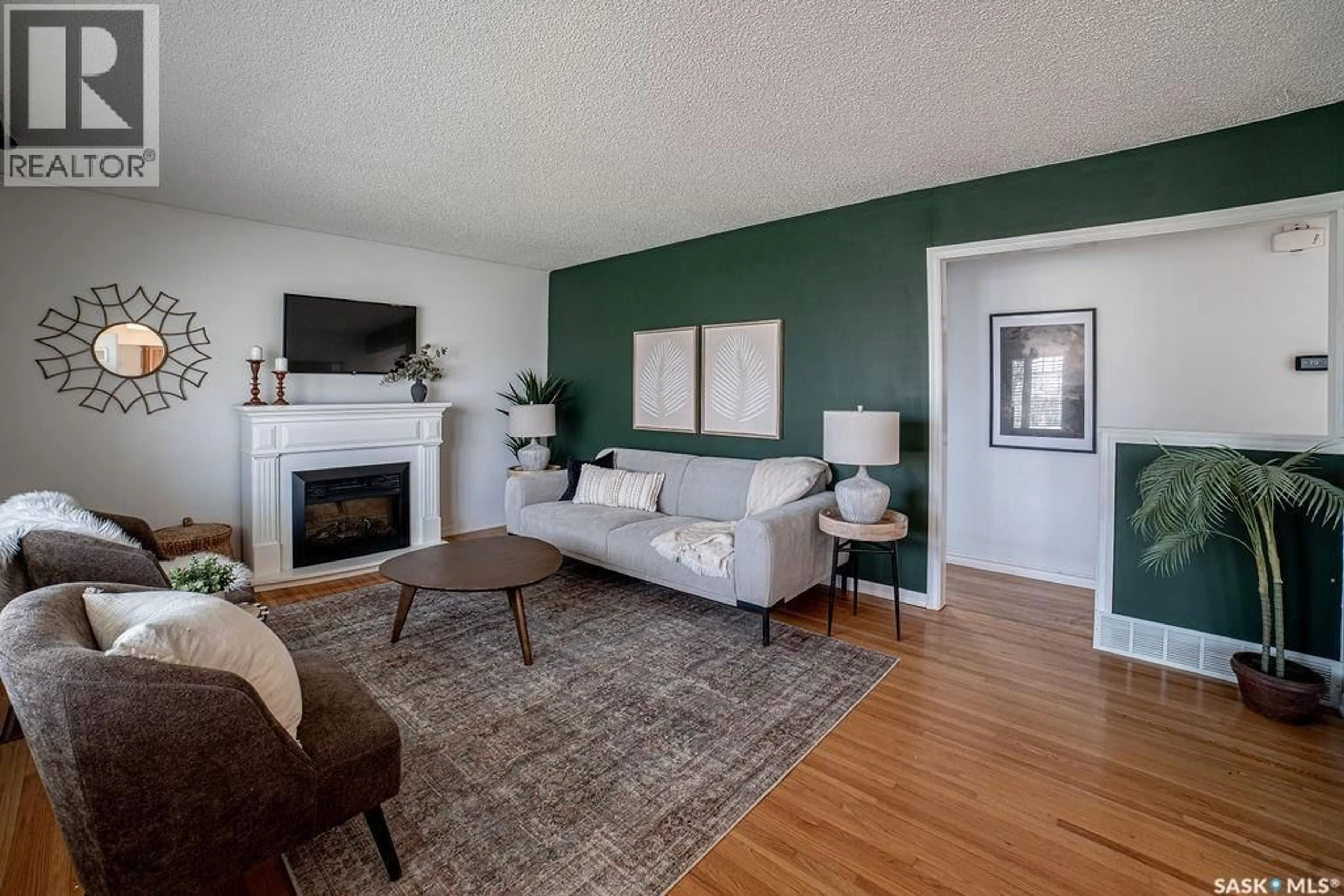 Living room with furniture, wood/laminate floor for 3807 LAKEVIEW STREET, Regina Saskatchewan S4S1H3