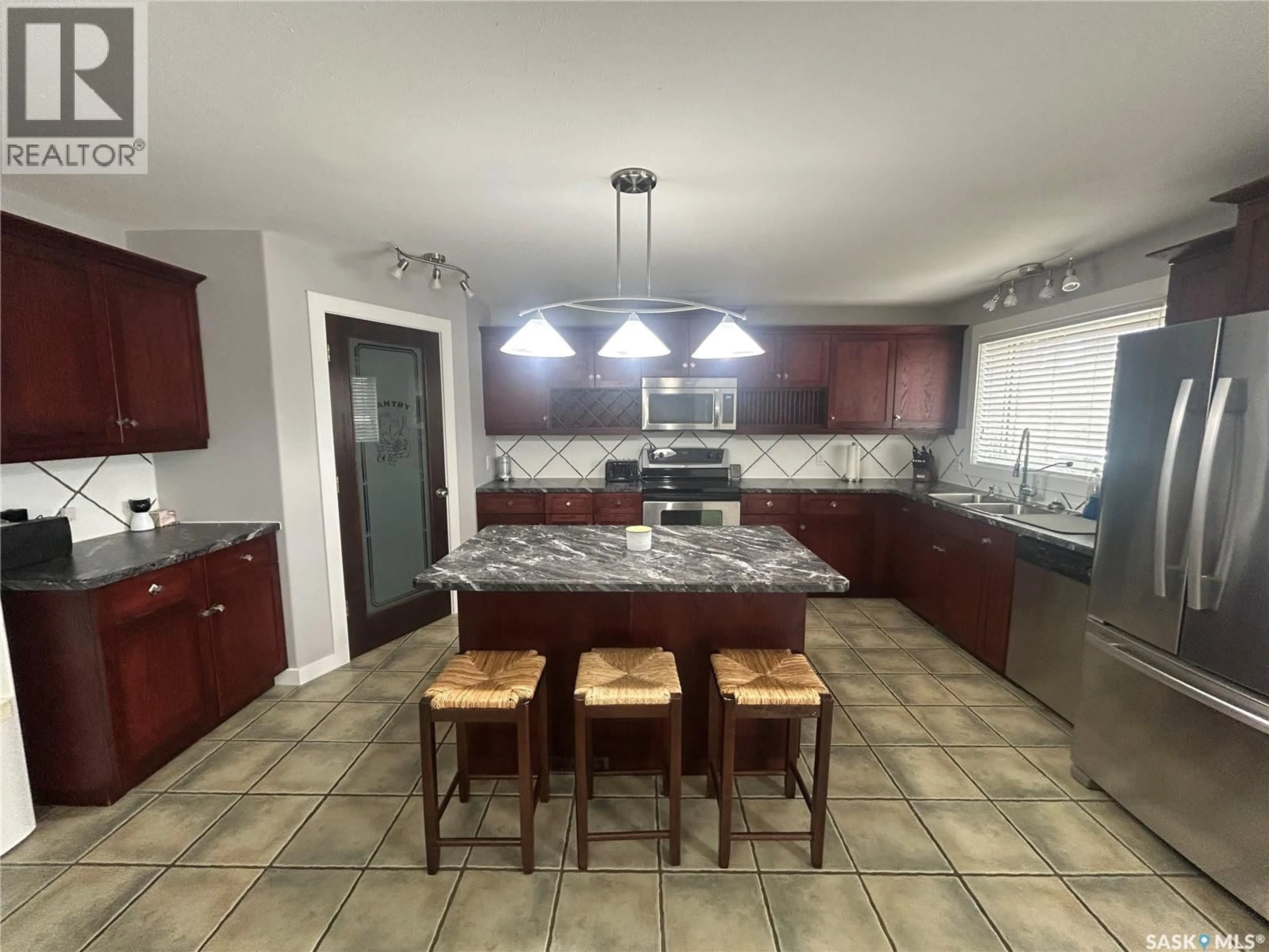 Open concept kitchen, ceramic/tile floor for 219 CRAWFORD AVENUE, Melfort Saskatchewan S0E1A0