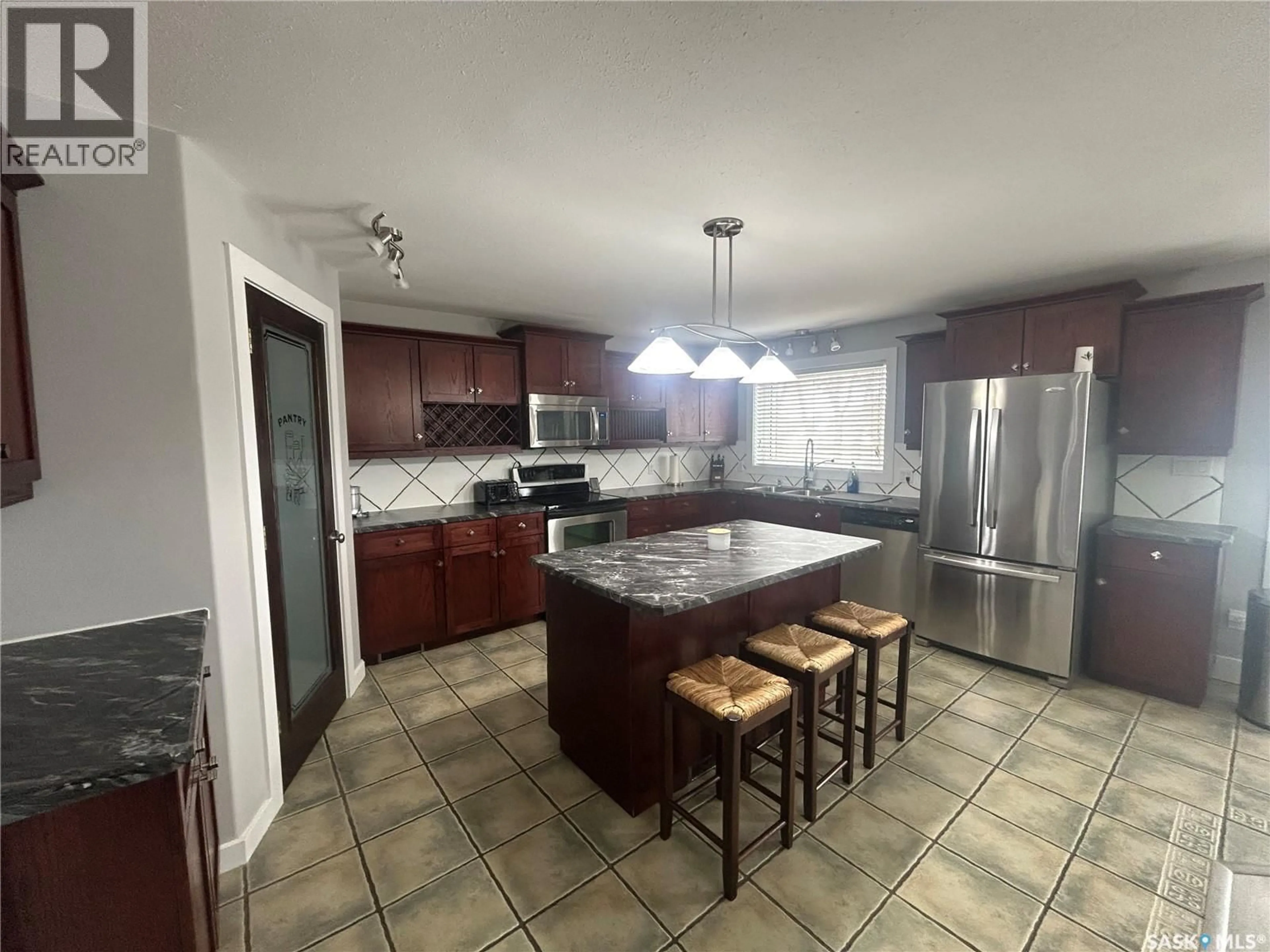 Open concept kitchen, ceramic/tile floor for 219 CRAWFORD AVENUE, Melfort Saskatchewan S0E1A0