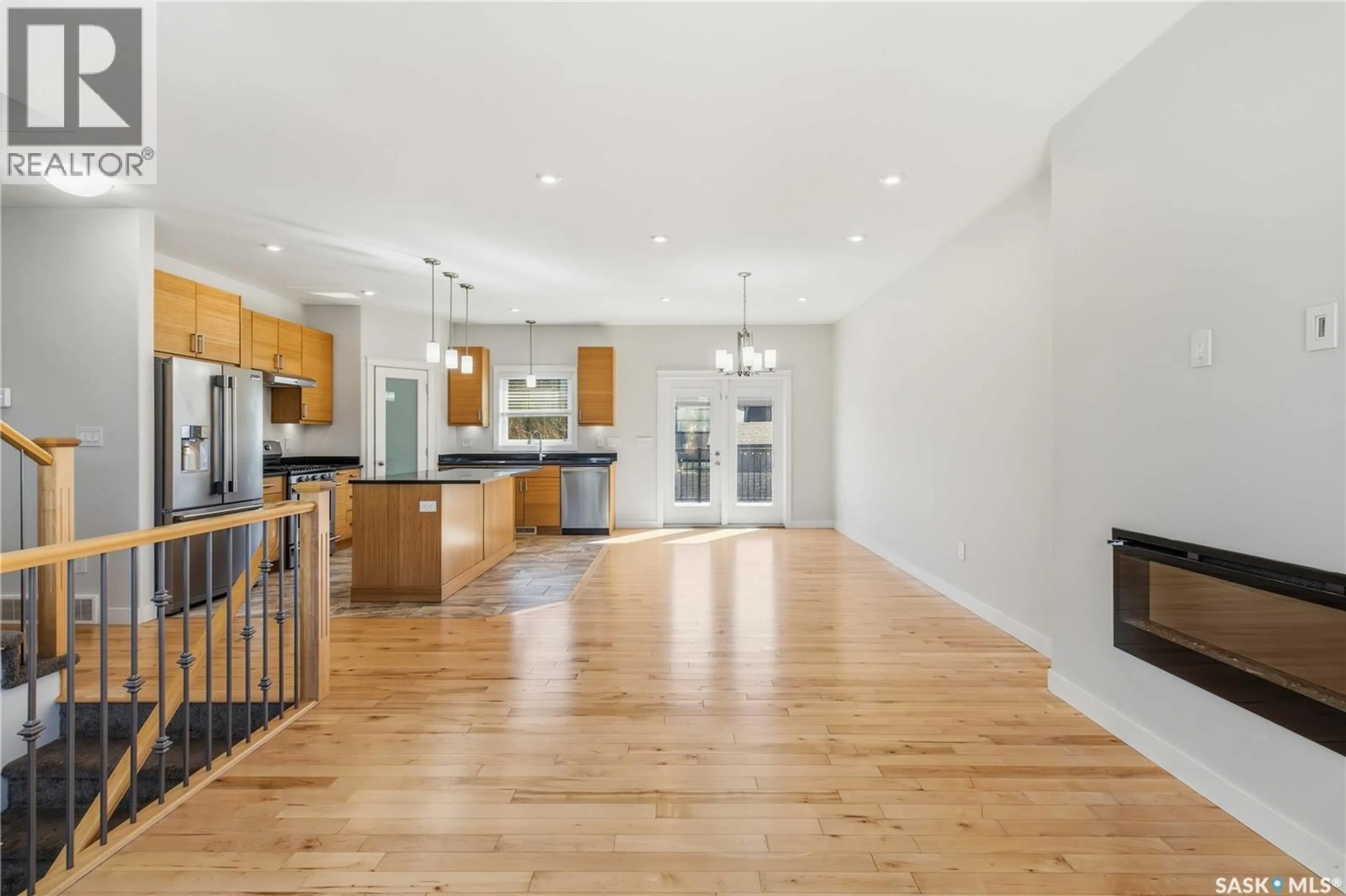 Open concept kitchen, wood/laminate floor for 175 GILLIES LANE, Saskatoon Saskatchewan S7V0J8