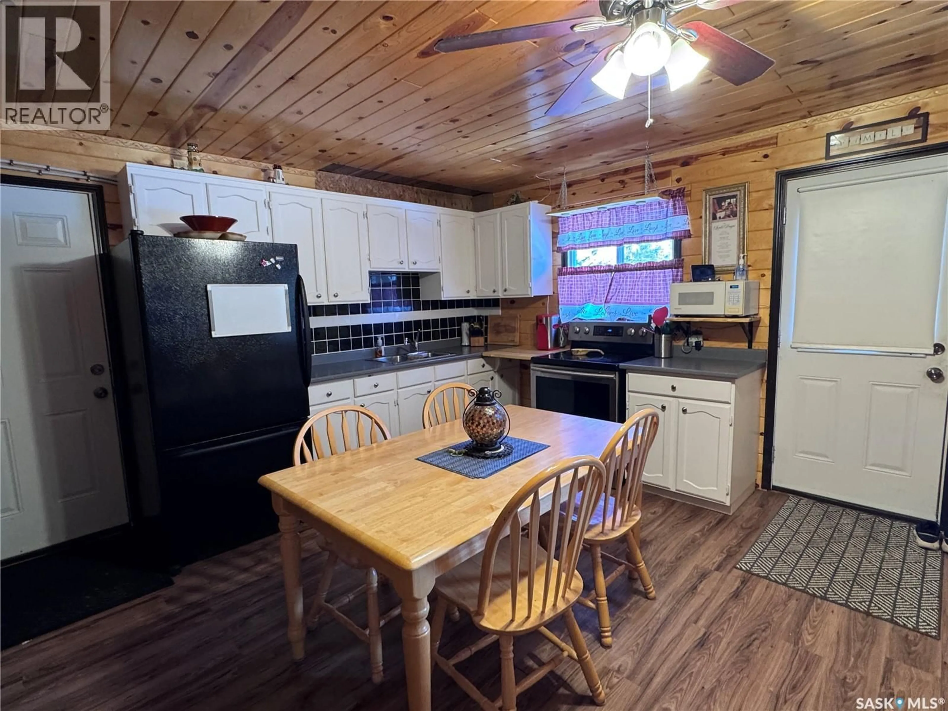 Open concept kitchen, wood/laminate floor for 2 ERMINE PLACE, Weyakwin Saskatchewan S0J0E3