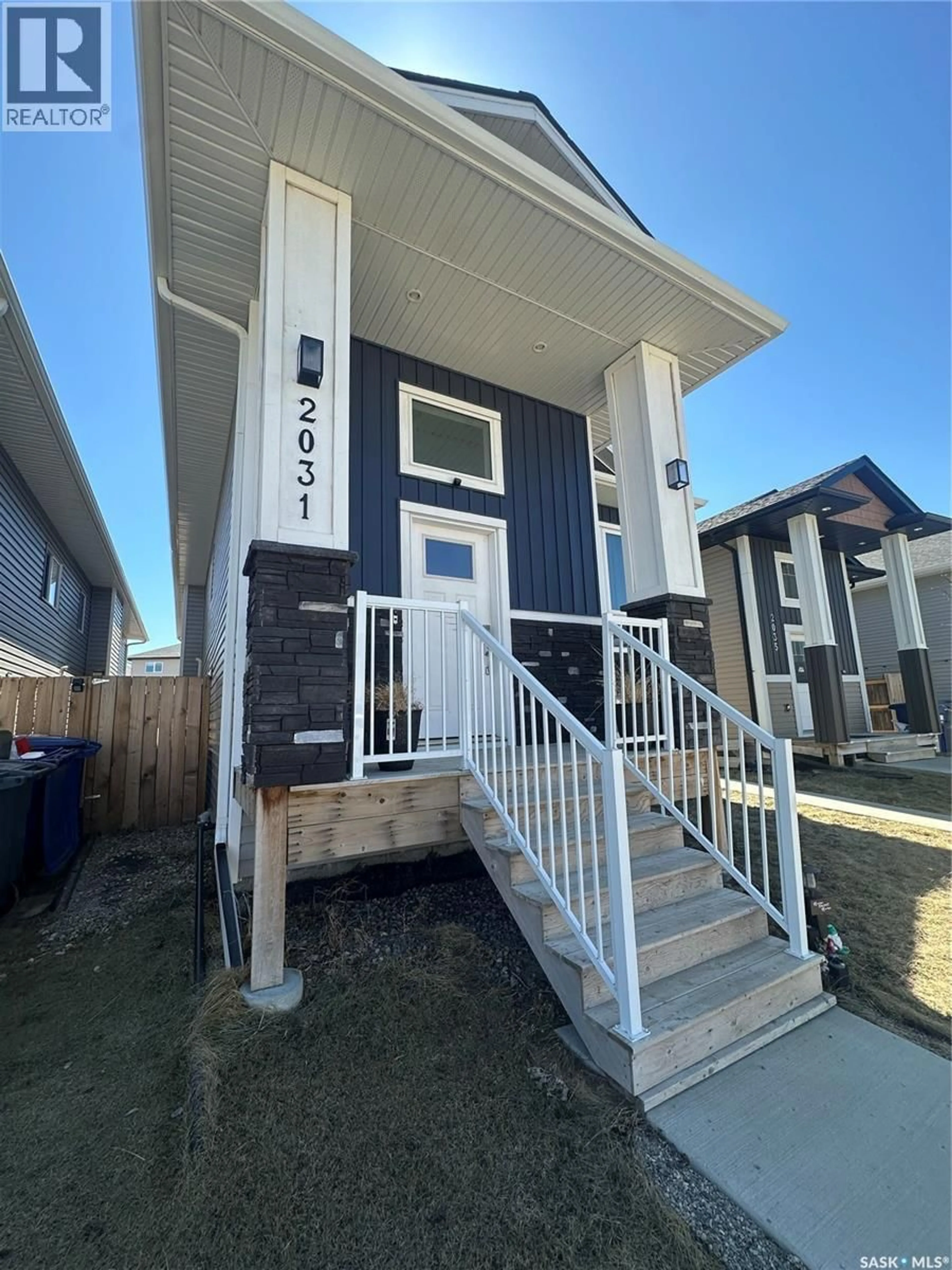 Home with vinyl exterior material, street for 2031 KENSINGTON ROAD, Saskatoon Saskatchewan S7L6P5