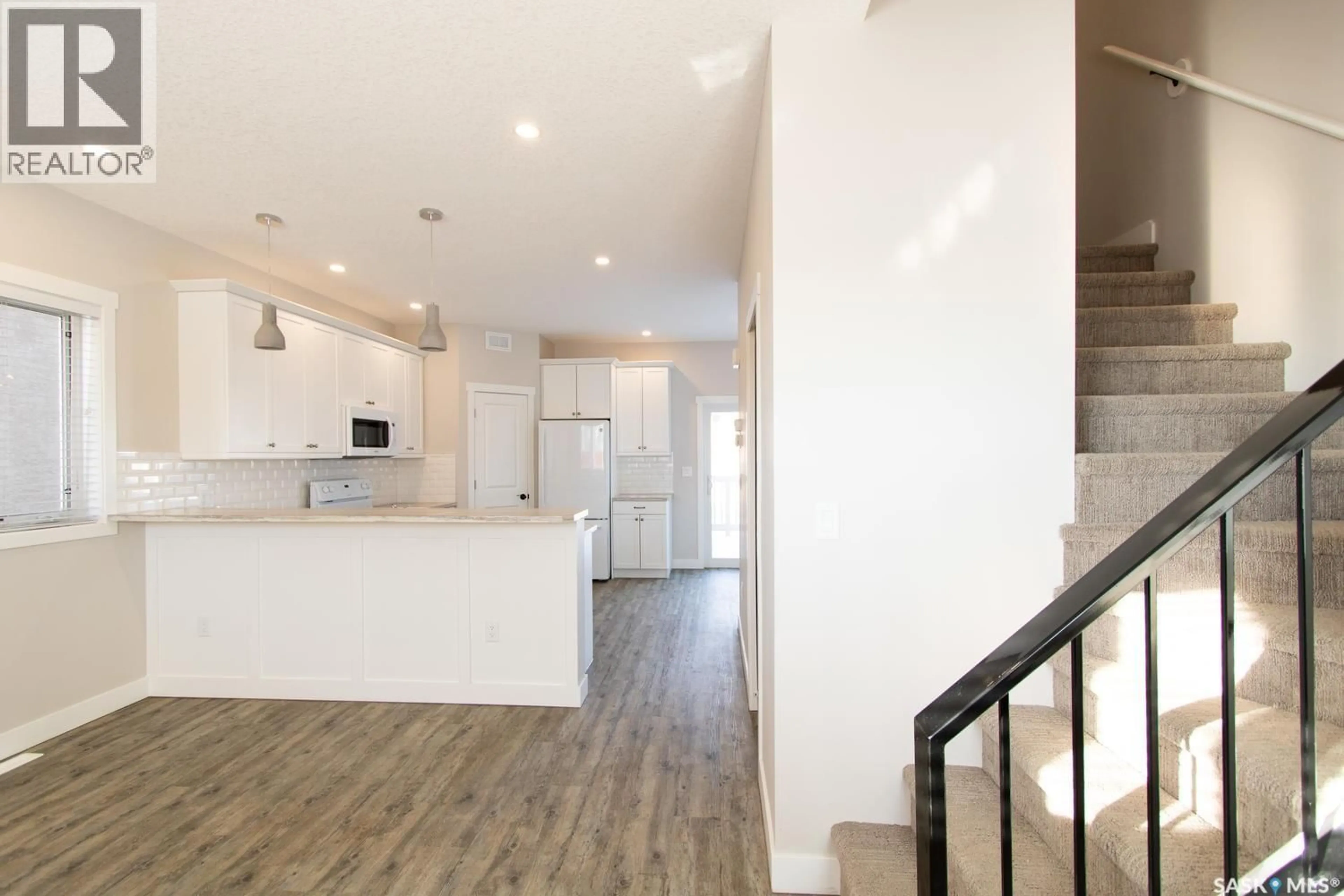 Open concept kitchen, wood/laminate floor for 460 FORGET STREET, Regina Saskatchewan S4R4X9