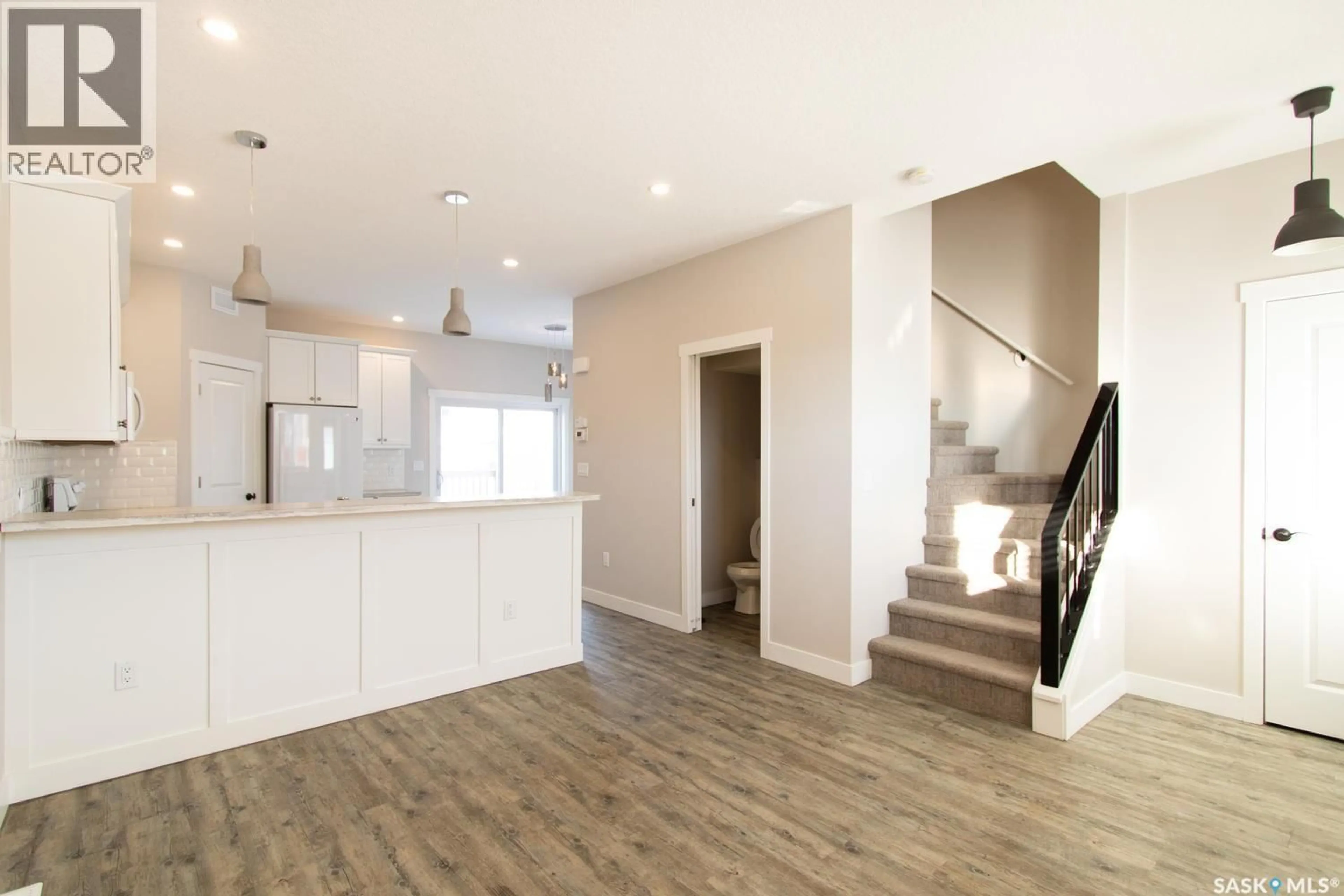 Open concept kitchen, wood/laminate floor for 460 FORGET STREET, Regina Saskatchewan S4R4X9
