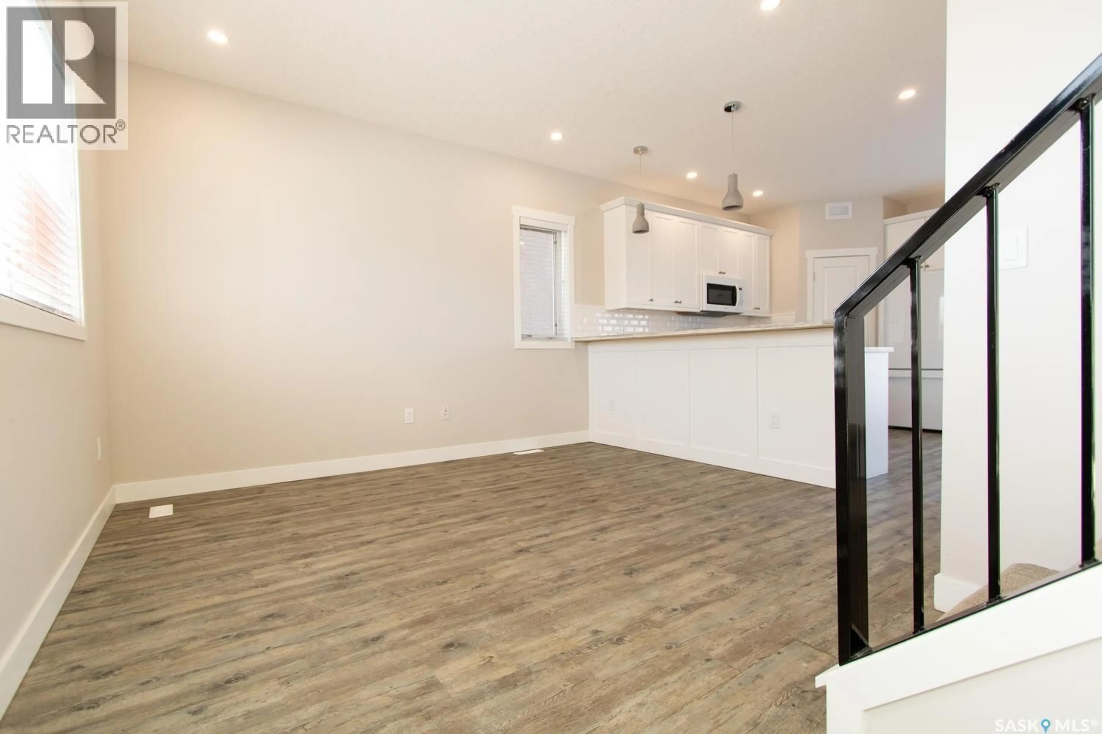 Open concept kitchen, wood/laminate floor for 460 FORGET STREET, Regina Saskatchewan S4R4X9