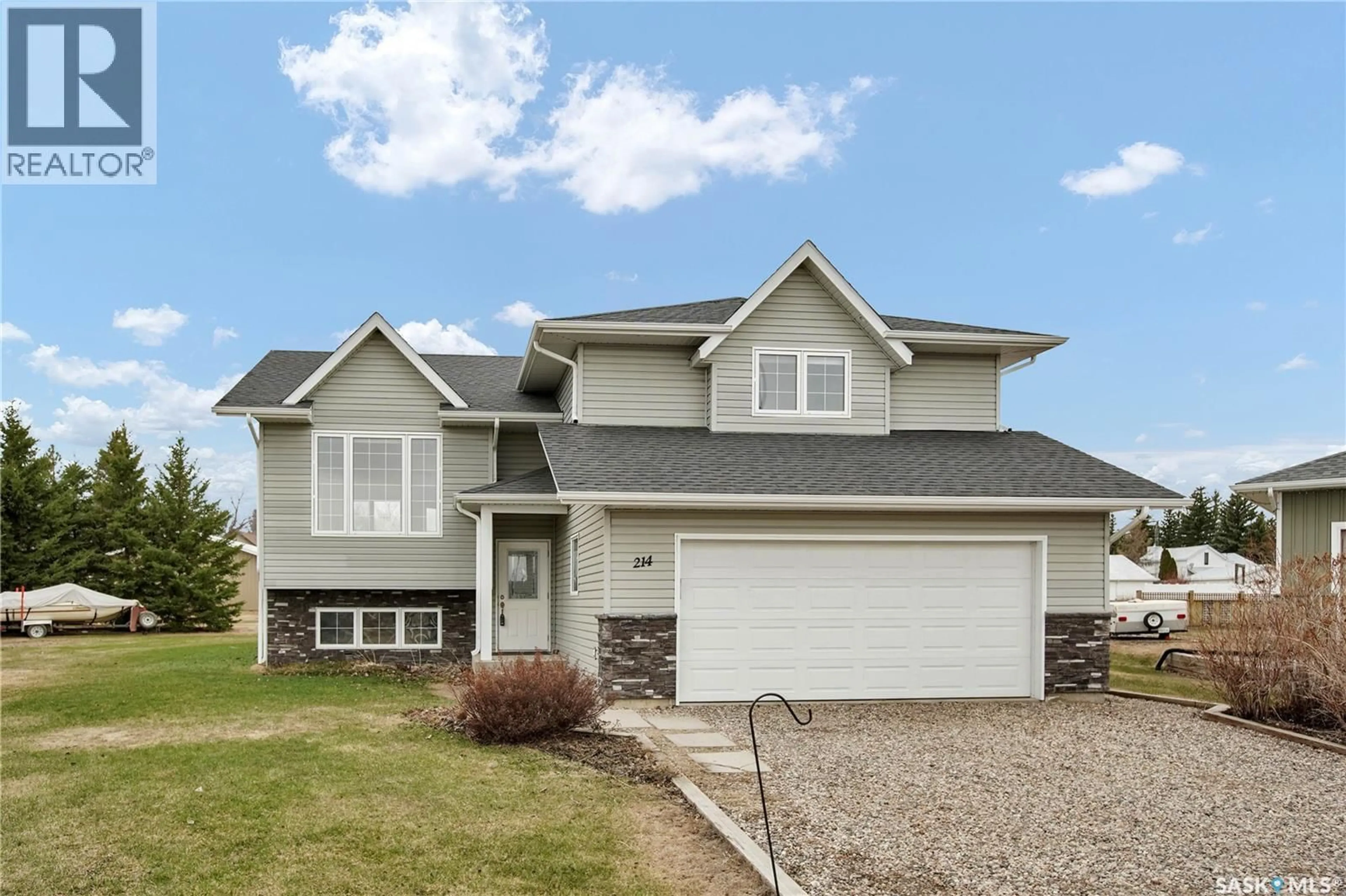 Home with vinyl exterior material, street for 214 CEDAR PLACE, Waldheim Saskatchewan S0K4R0