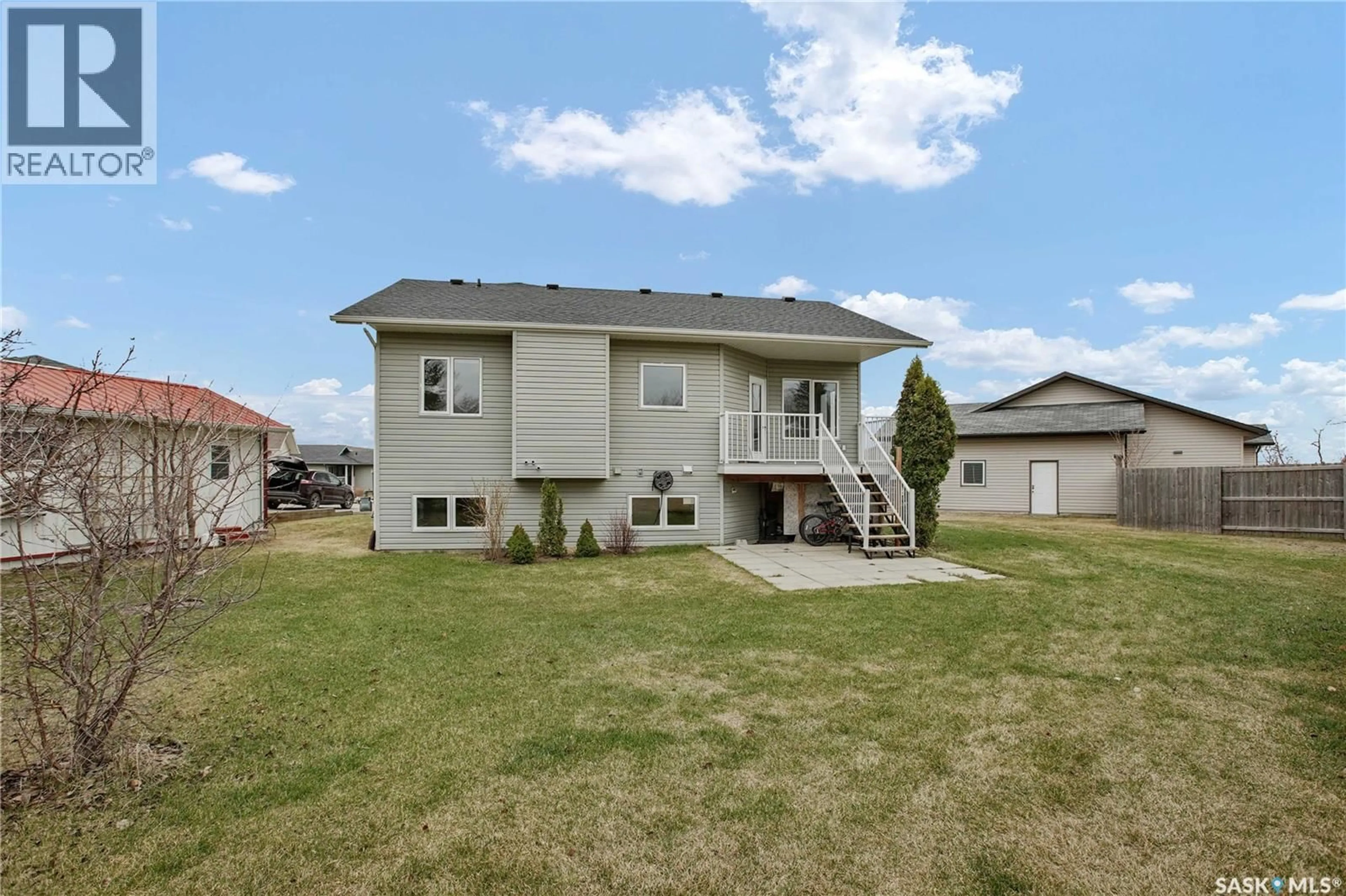 Home with vinyl exterior material, street for 214 CEDAR PLACE, Waldheim Saskatchewan S0K4R0