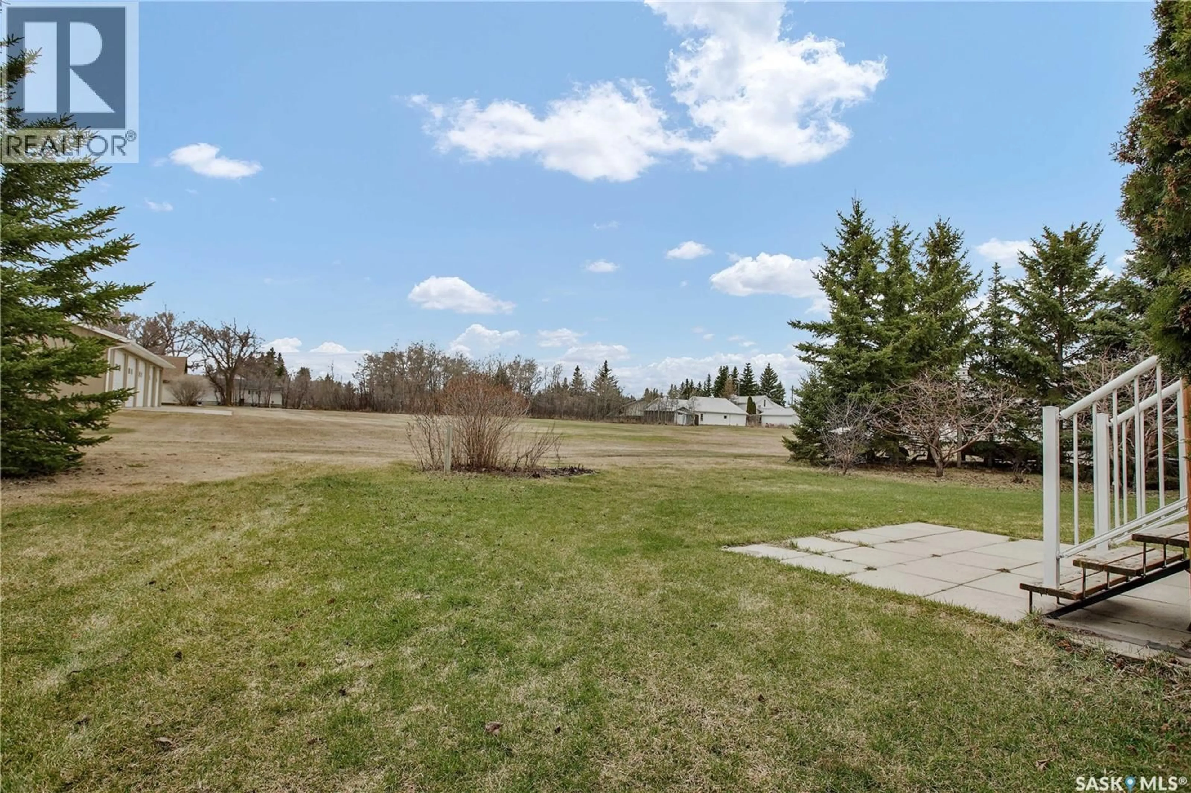 A pic from outside/outdoor area/front of a property/back of a property/a pic from drone, water/lake/river/ocean view for 214 CEDAR PLACE, Waldheim Saskatchewan S0K4R0