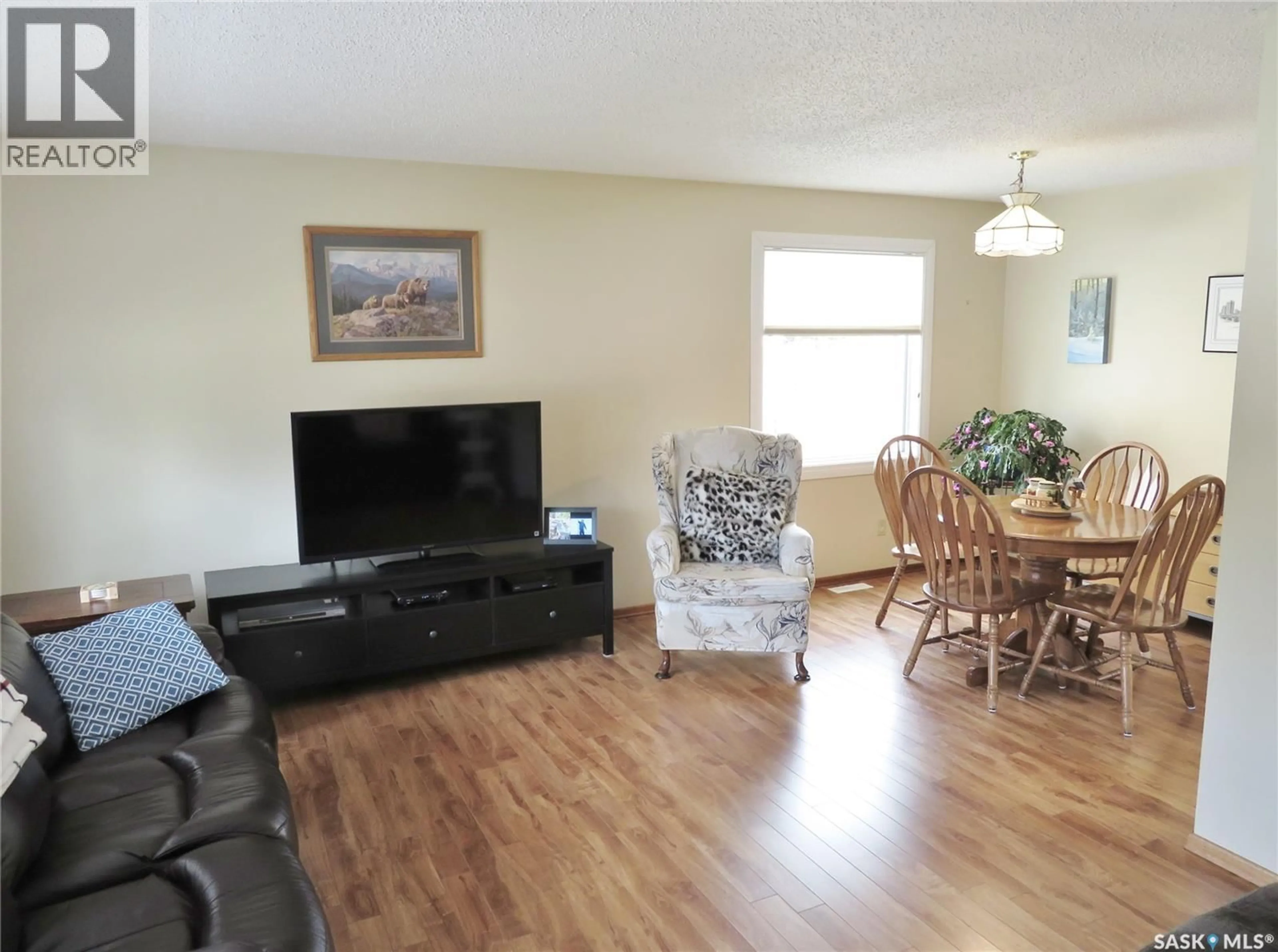 Living room with furniture, wood/laminate floor for 315 BENESH CRESCENT, Saskatoon Saskatchewan S7K6P1