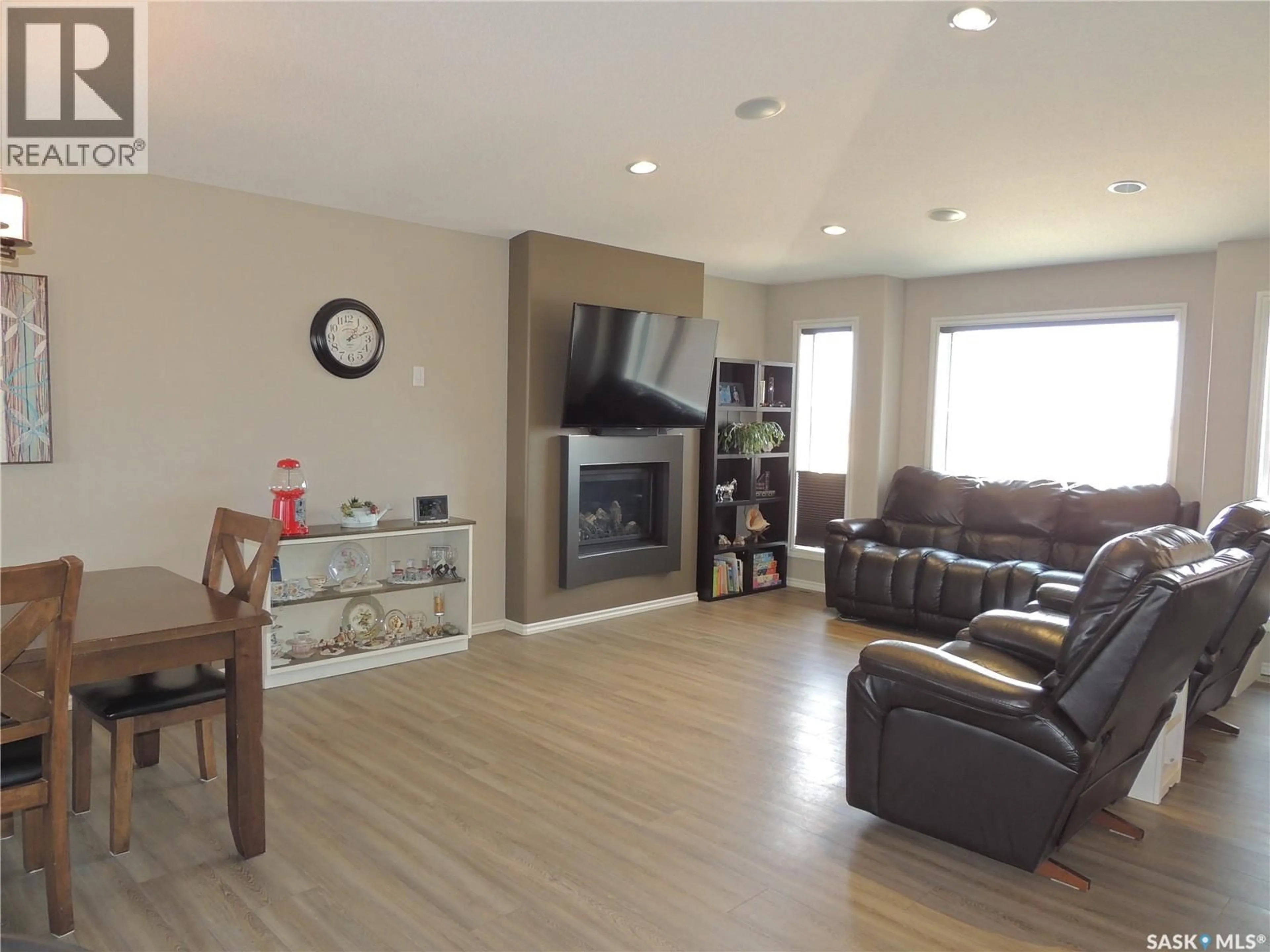 Living room with furniture, wood/laminate floor for ANDERSON ACREAGE, Estevan Rm No. 5 Saskatchewan S4A2A3