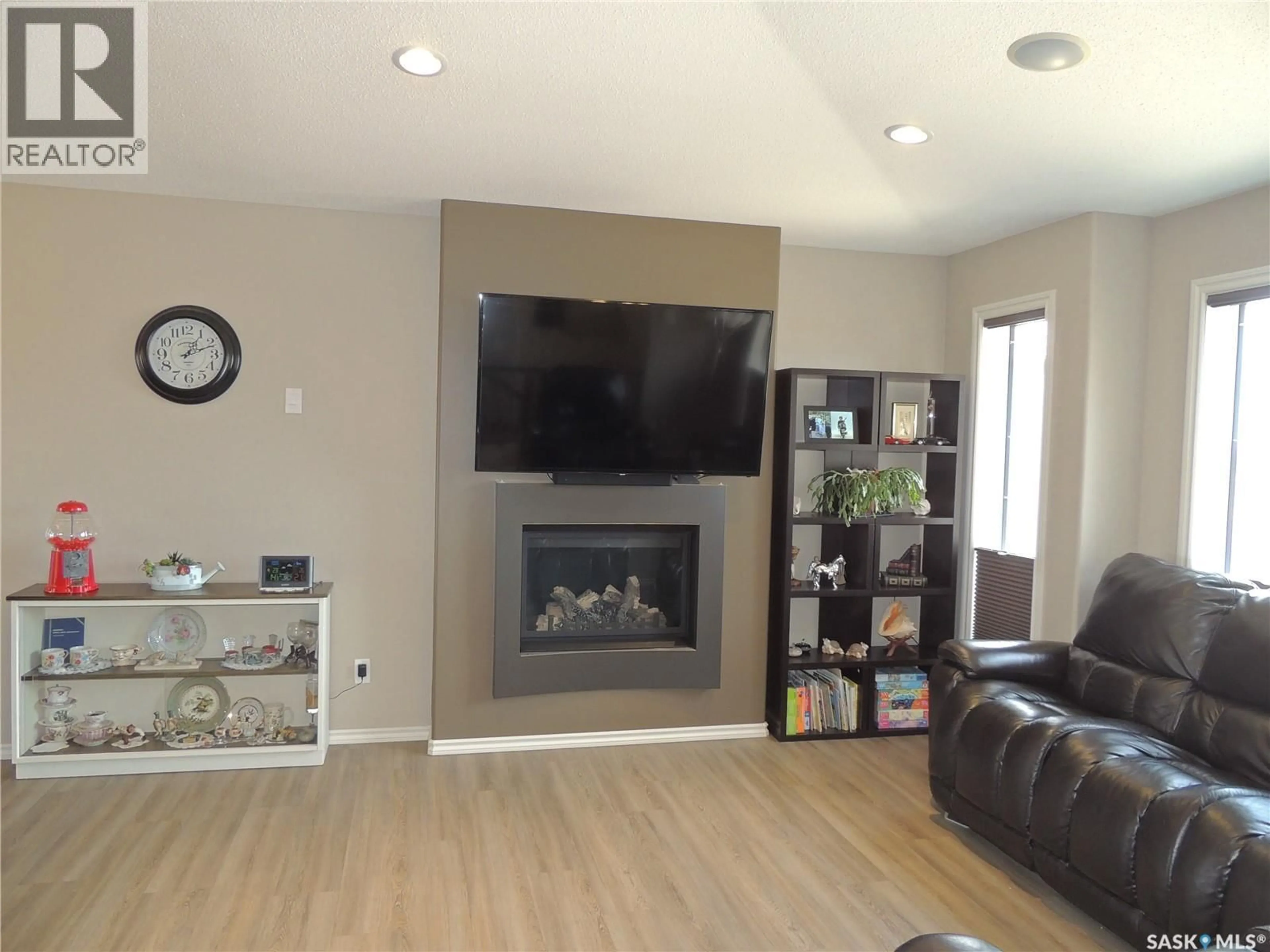 Living room with furniture, wood/laminate floor for ANDERSON ACREAGE, Estevan Rm No. 5 Saskatchewan S4A2A3
