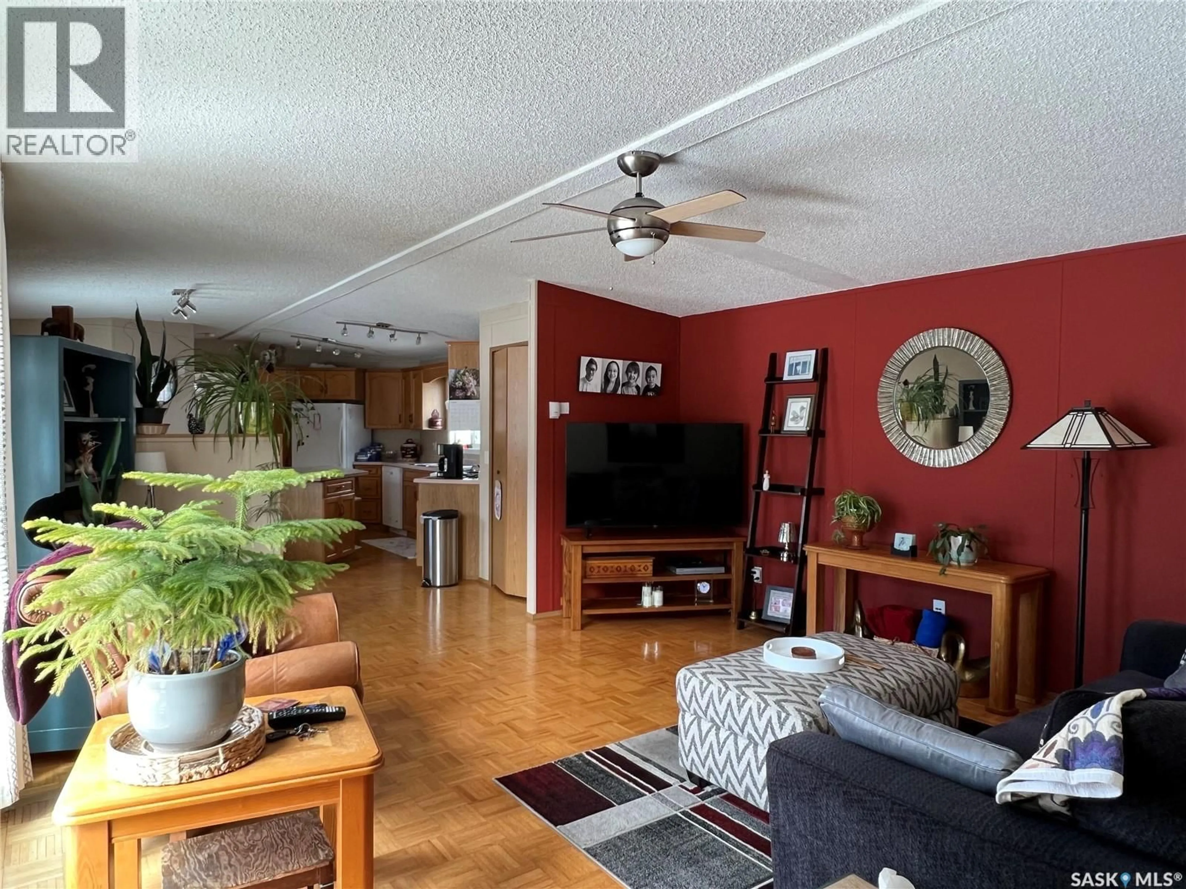 Living room with furniture, wood/laminate floor for 513 3RD STREET, Goodsoil Saskatchewan S0M1A0