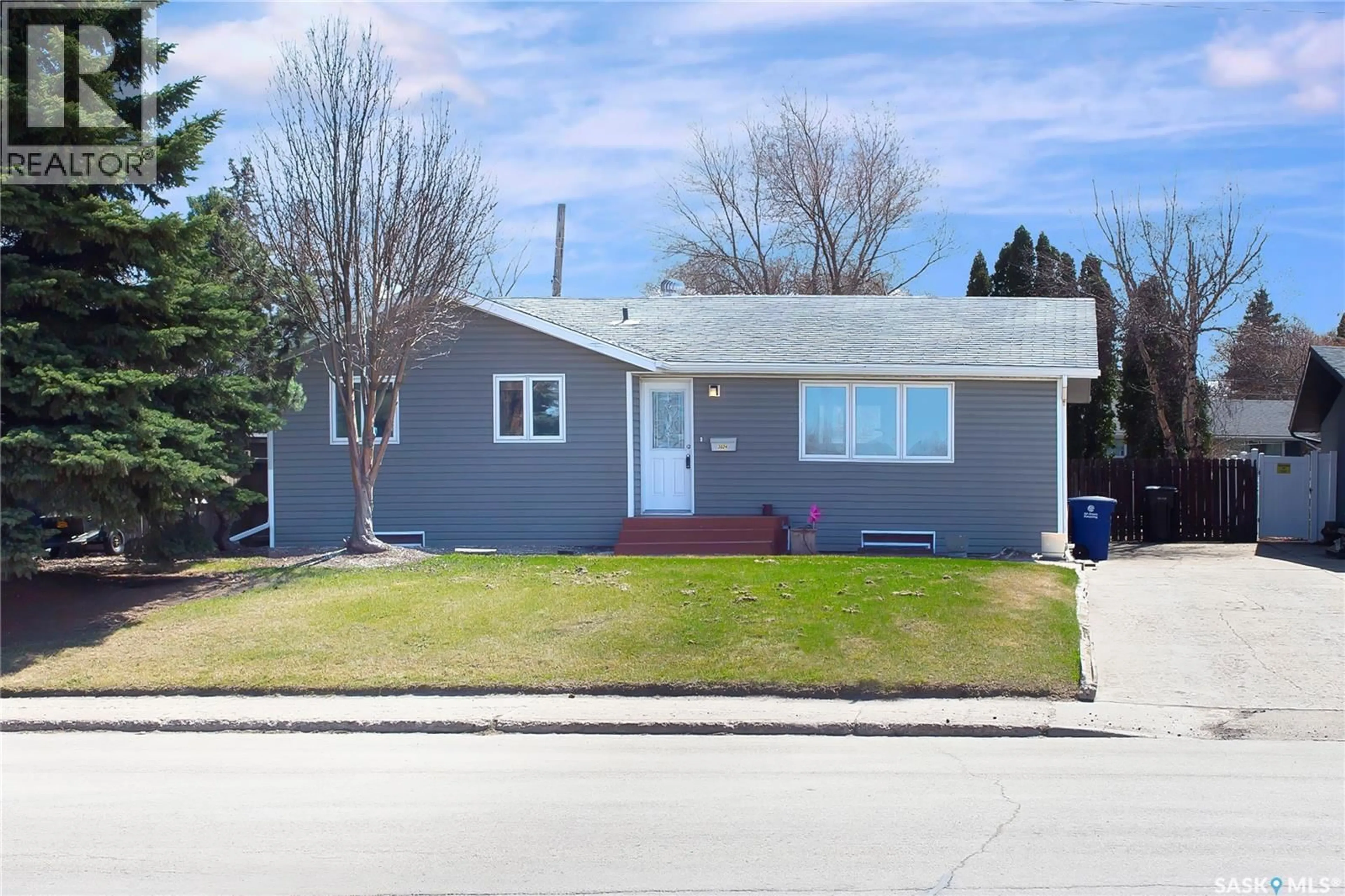 Home with vinyl exterior material, street for 3024 14TH STREET, Saskatoon Saskatchewan S7H0B4