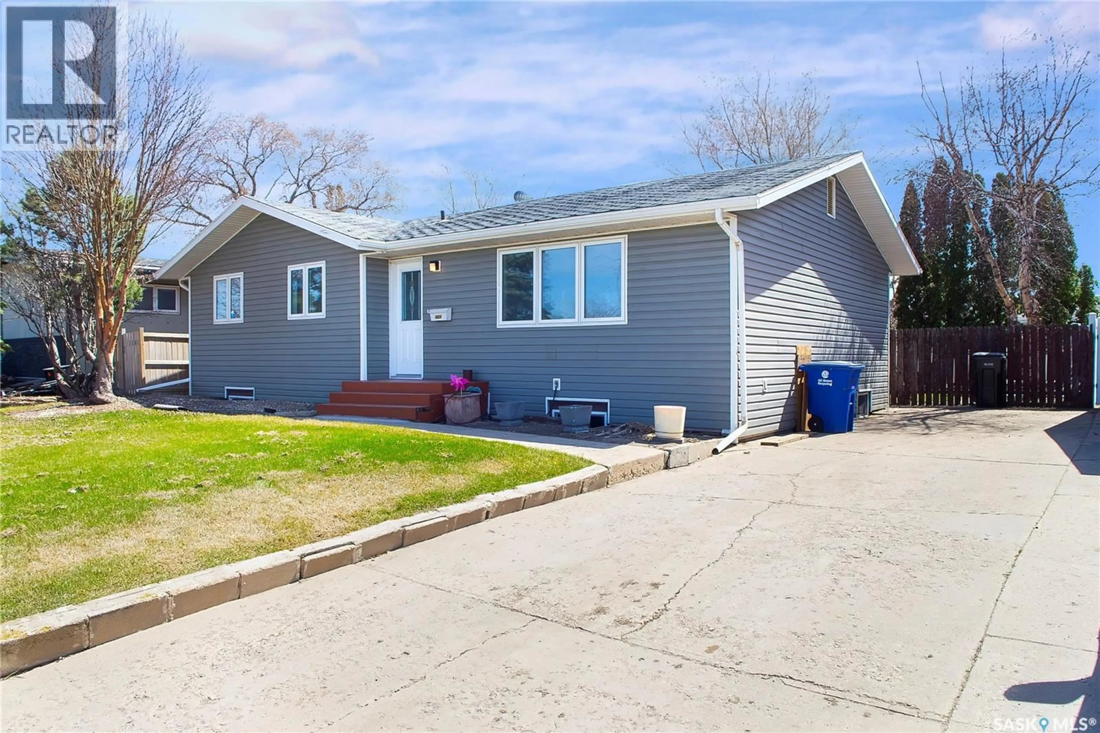 Home with vinyl exterior material, street for 3024 14TH STREET, Saskatoon Saskatchewan S7H0B4