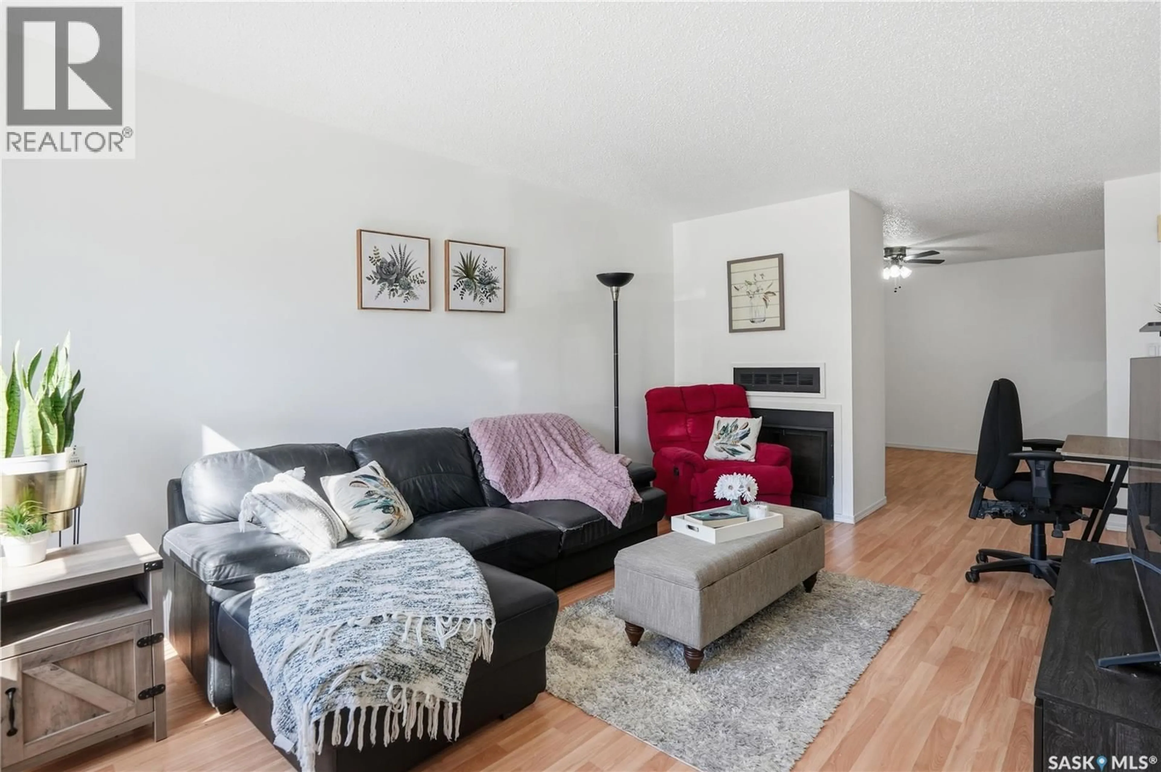 Living room with furniture, wood/laminate floor for 6549 ROCHDALE BOULEVARD, Regina Saskatchewan S4X2Z1