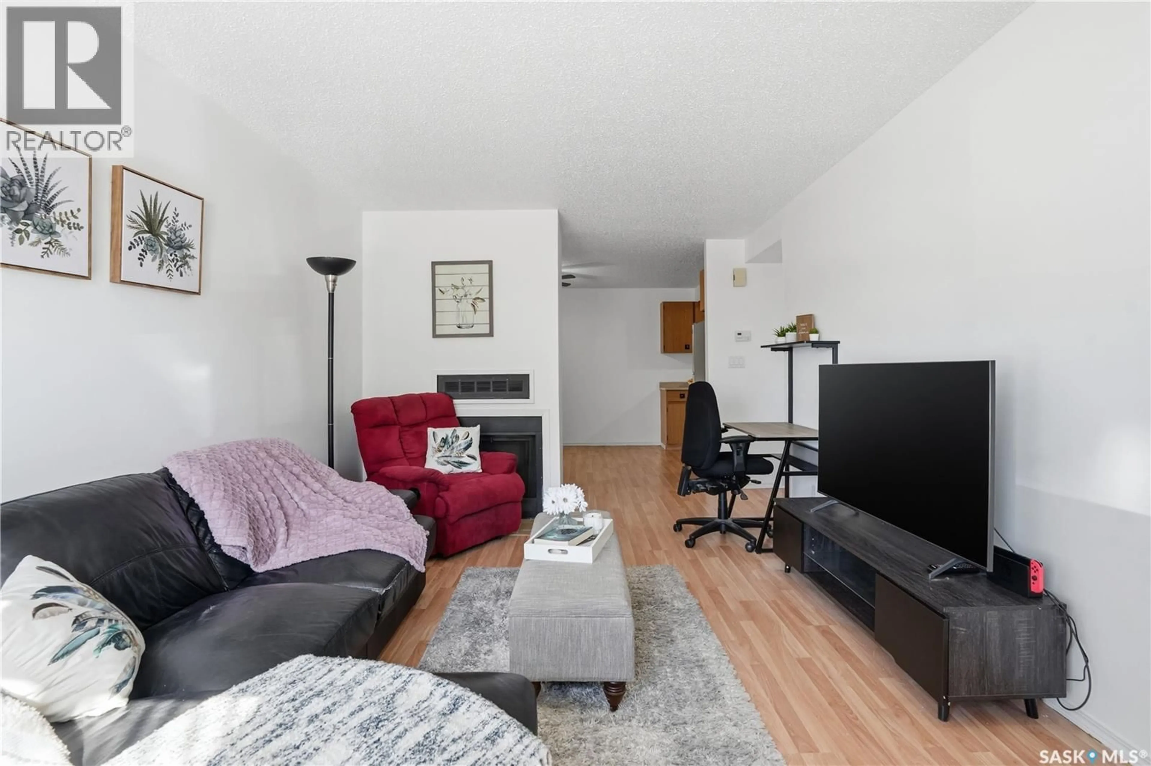 Living room with furniture, wood/laminate floor for 6549 ROCHDALE BOULEVARD, Regina Saskatchewan S4X2Z1