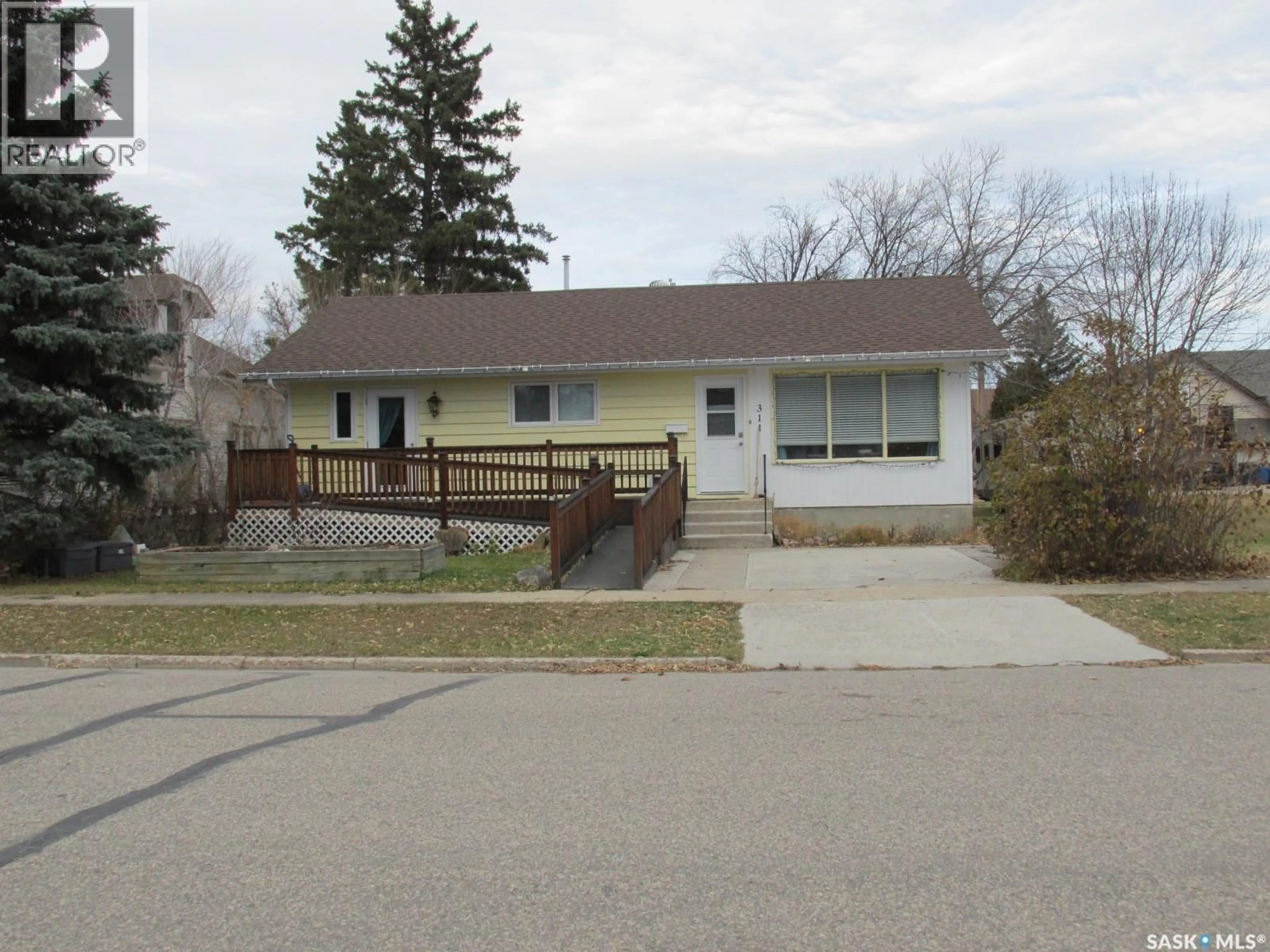 Home with vinyl exterior material, street for 311 1ST STREET, Nipawin Saskatchewan S0E1E0