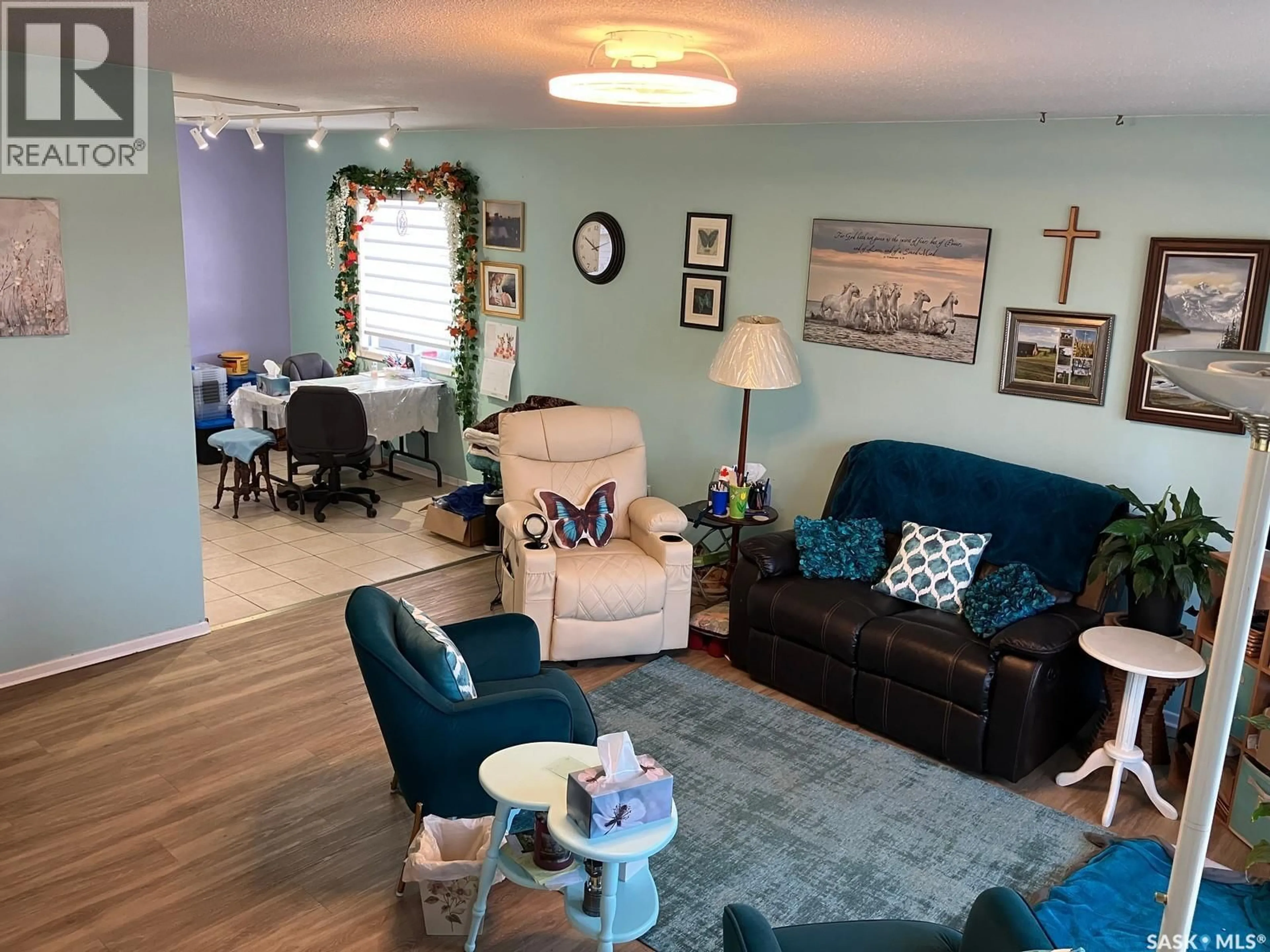 Living room with furniture, wood/laminate floor for 311 1ST STREET, Nipawin Saskatchewan S0E1E0