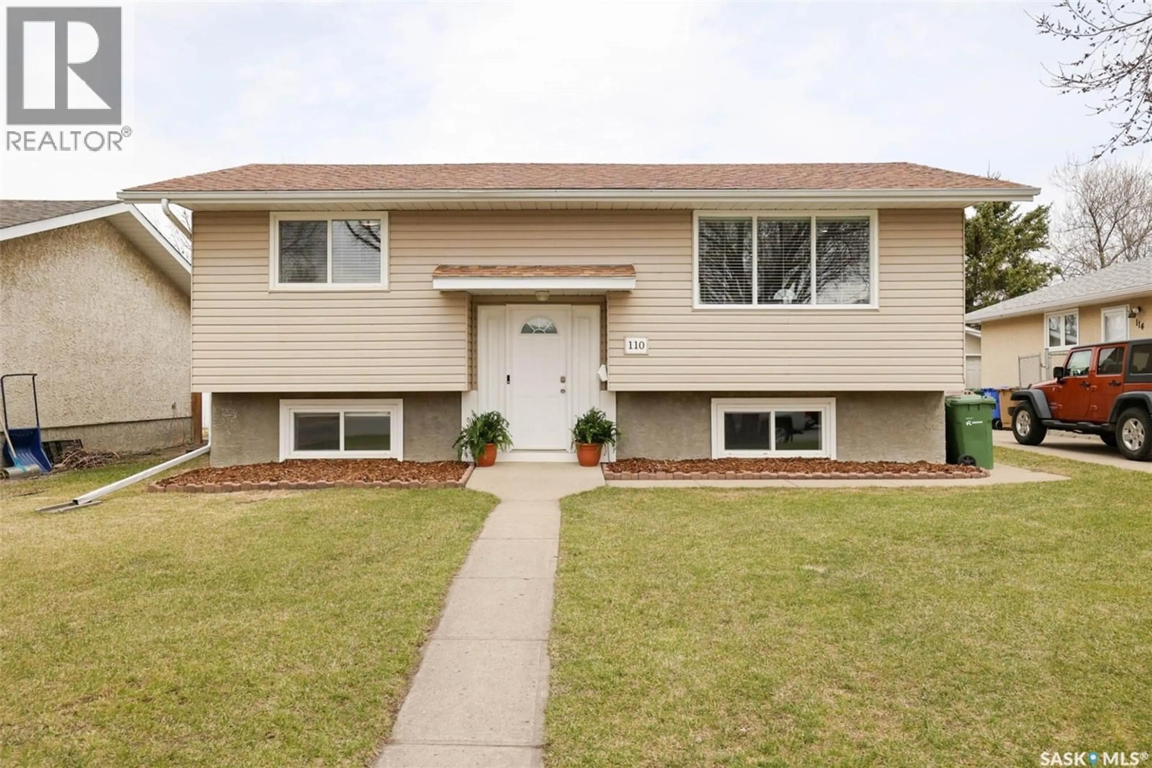 Home with vinyl exterior material, street for 110 FULTON DRIVE, Regina Saskatchewan S4X1G1