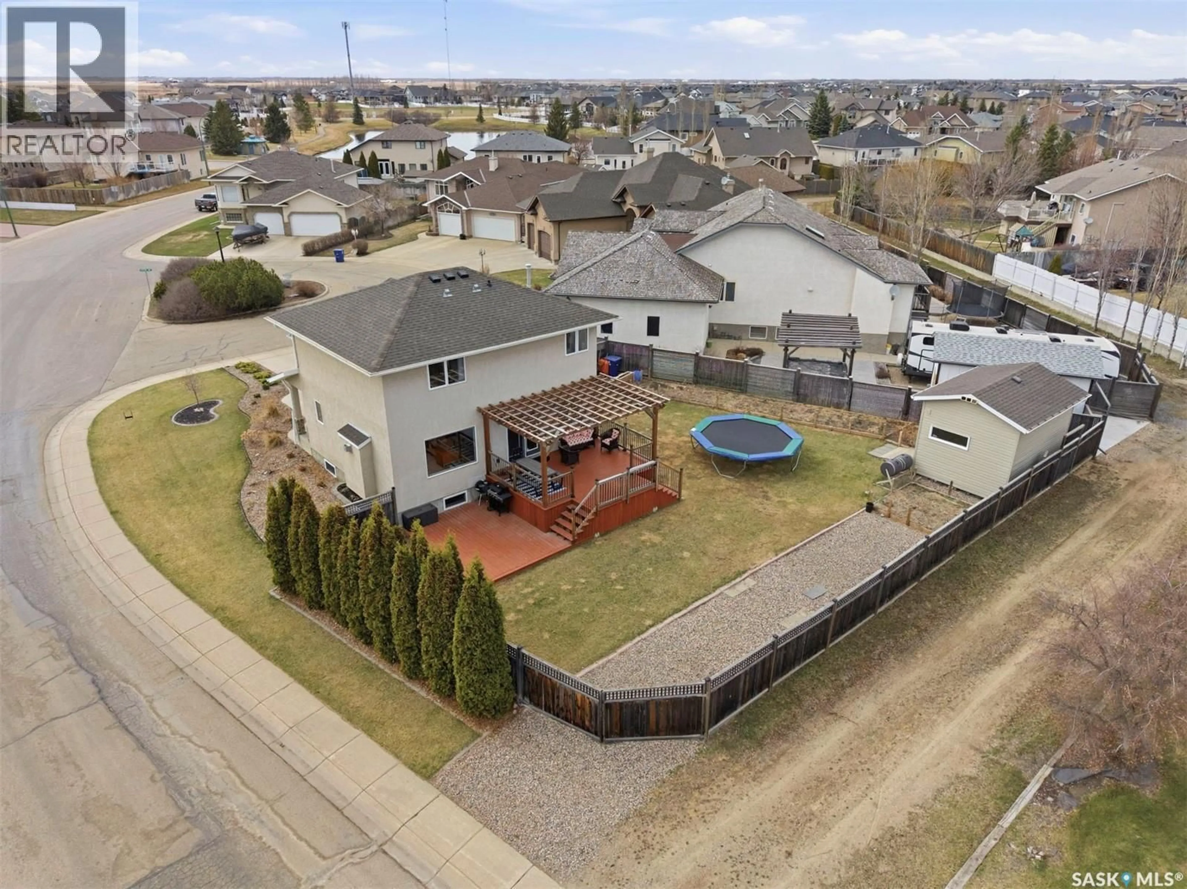 A pic from outside/outdoor area/front of a property/back of a property/a pic from drone, street for 402 CRYSTAL BAY, Warman Saskatchewan S0K0A1