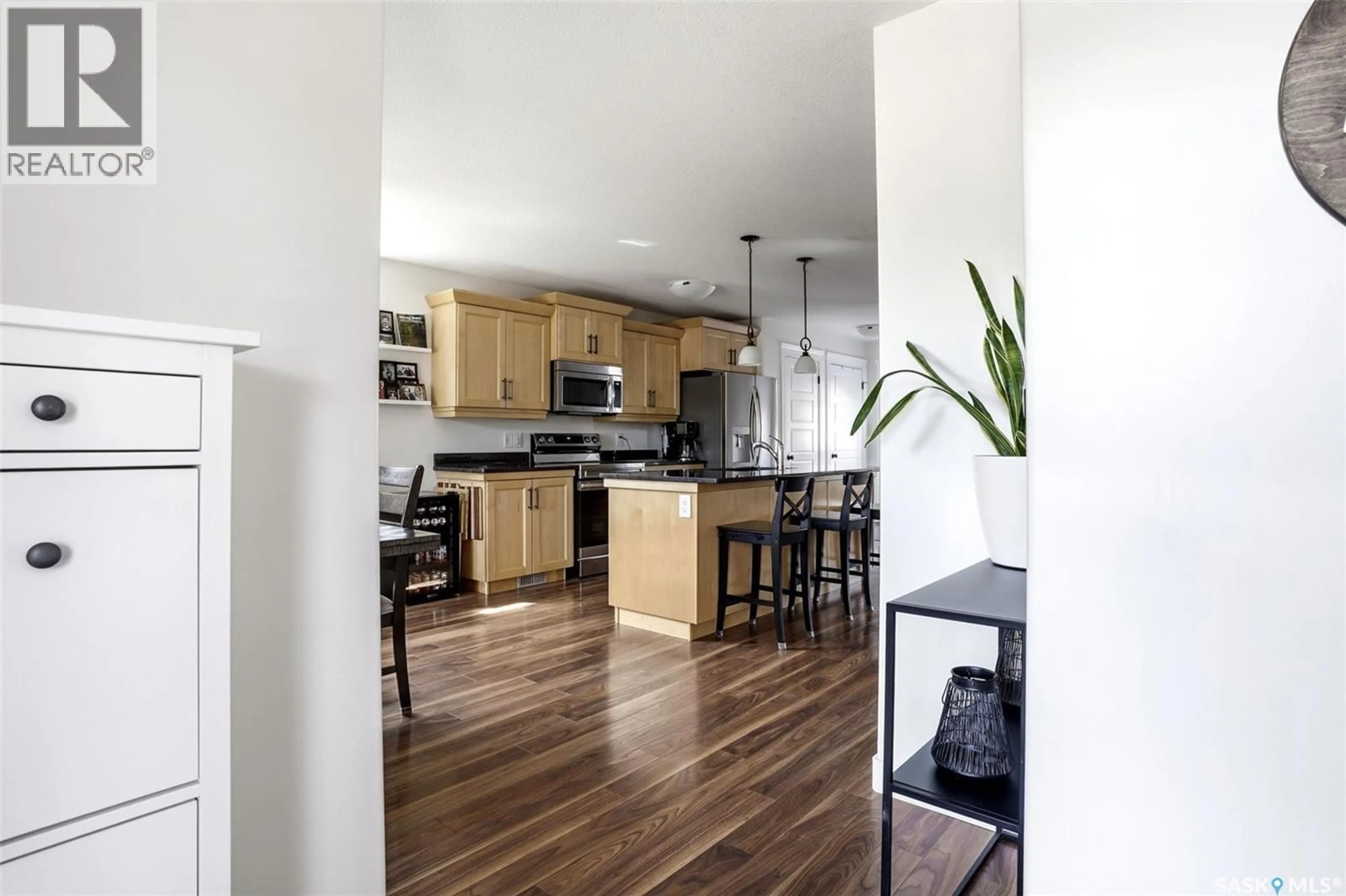 Open concept kitchen, wood/laminate floor for 1106 POLEY STREET, Regina Saskatchewan S4X0K2