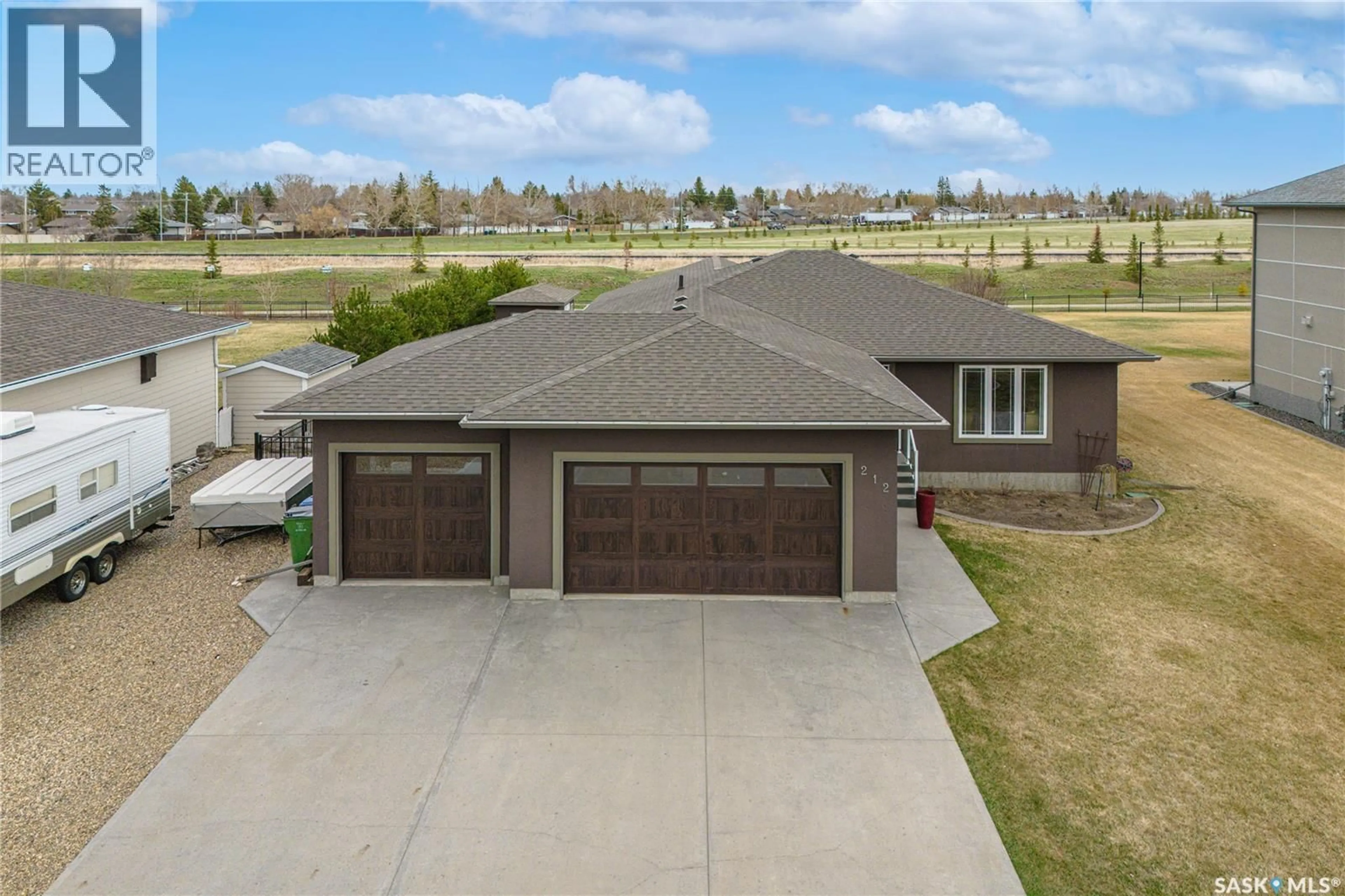 A pic from outside/outdoor area/front of a property/back of a property/a pic from drone, unknown for 212 IRON BRIDGE DRIVE, Moose Jaw Saskatchewan S6J0B5