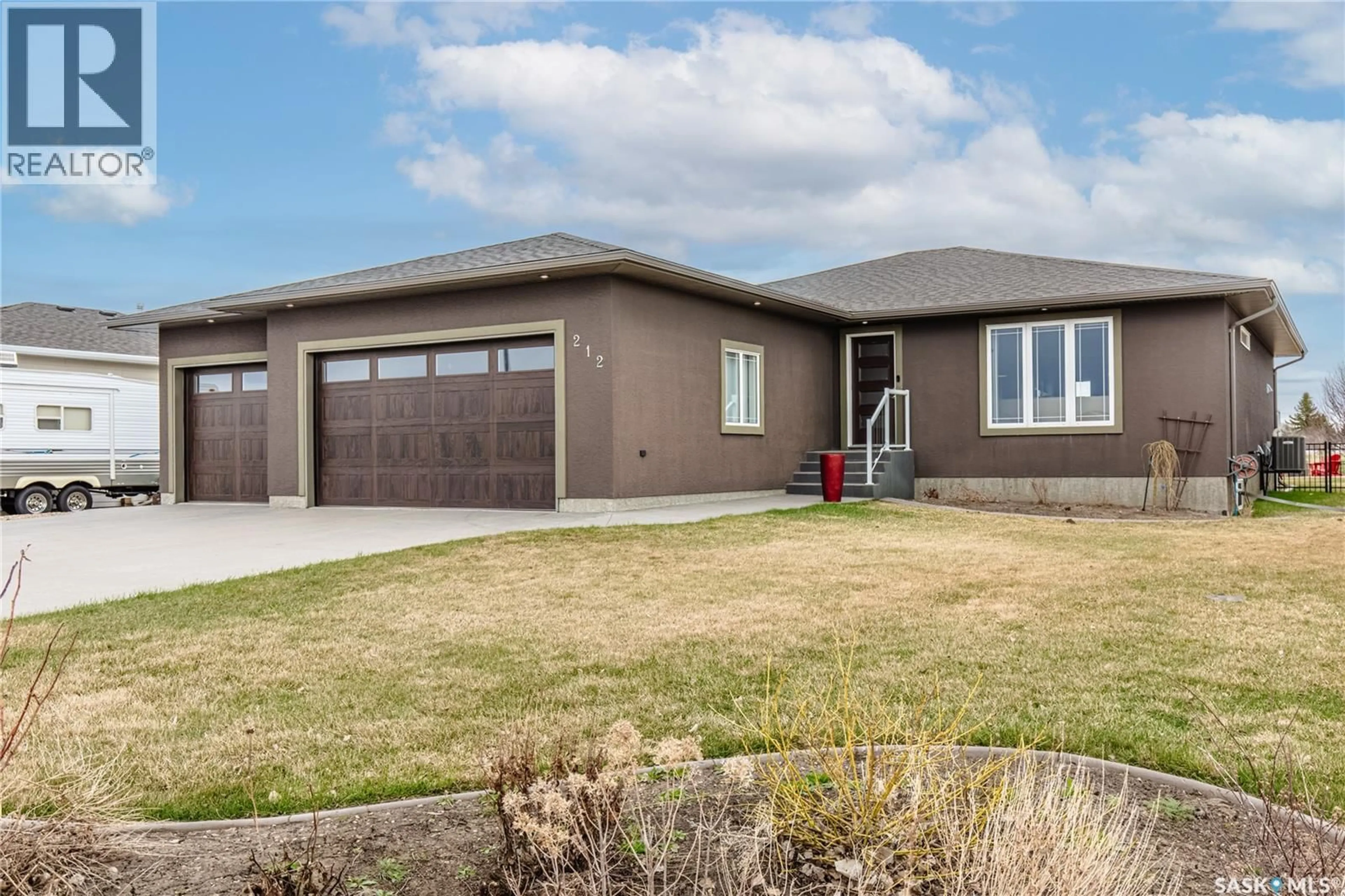 Home with brick exterior material, street for 212 IRON BRIDGE DRIVE, Moose Jaw Saskatchewan S6J0B5