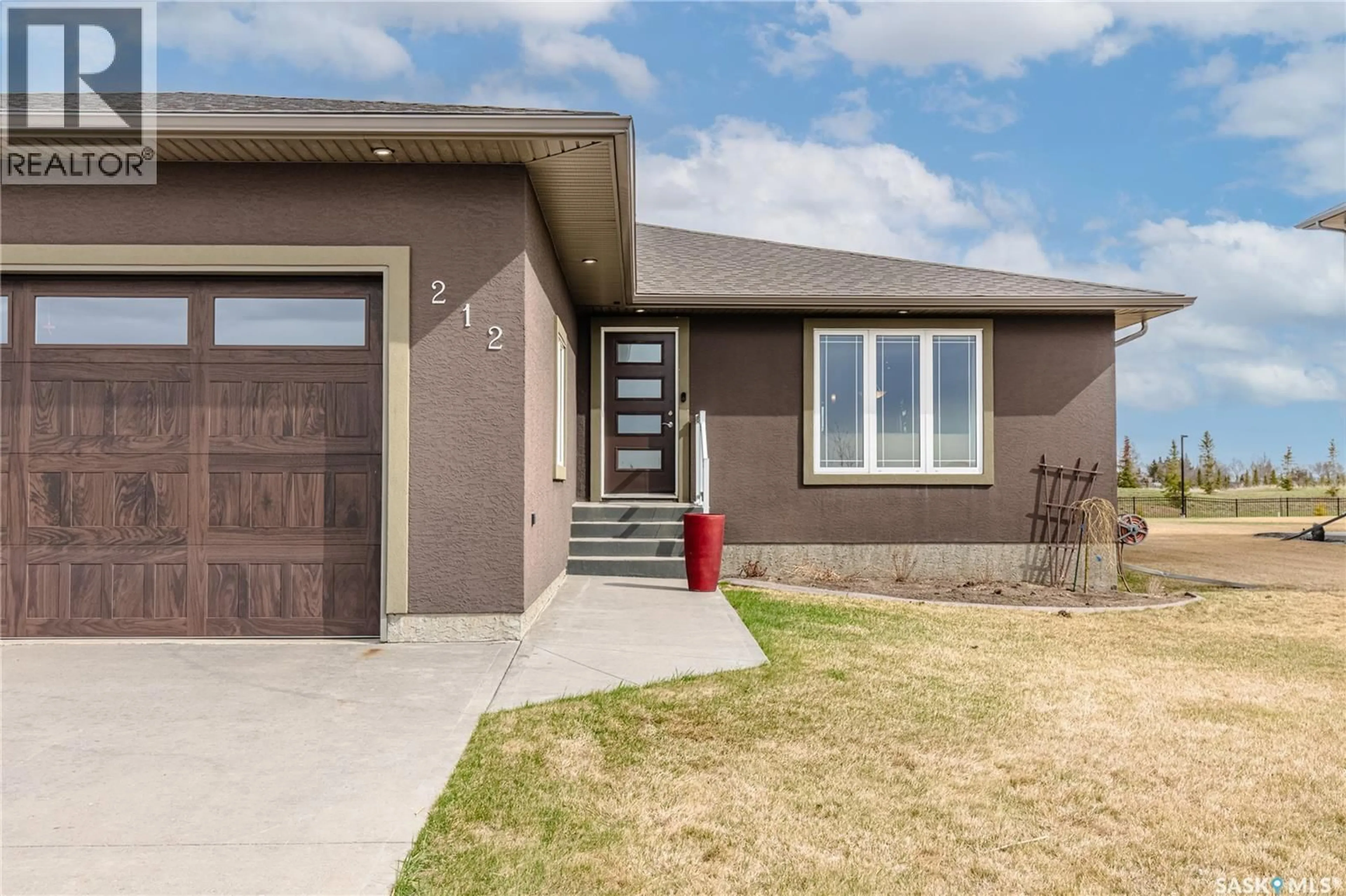 Home with brick exterior material, street for 212 IRON BRIDGE DRIVE, Moose Jaw Saskatchewan S6J0B5