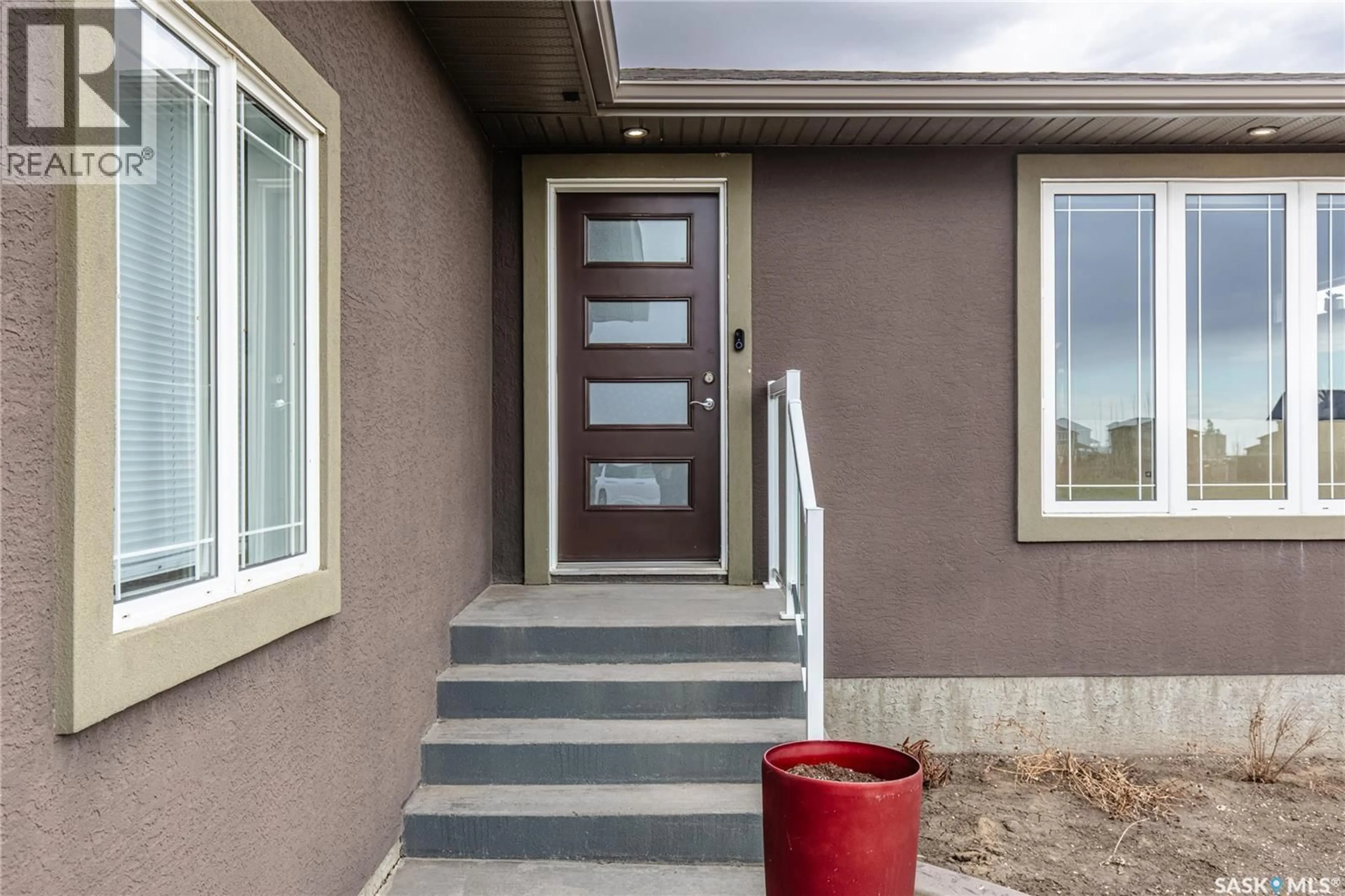 Home with vinyl exterior material, street for 212 IRON BRIDGE DRIVE, Moose Jaw Saskatchewan S6J0B5