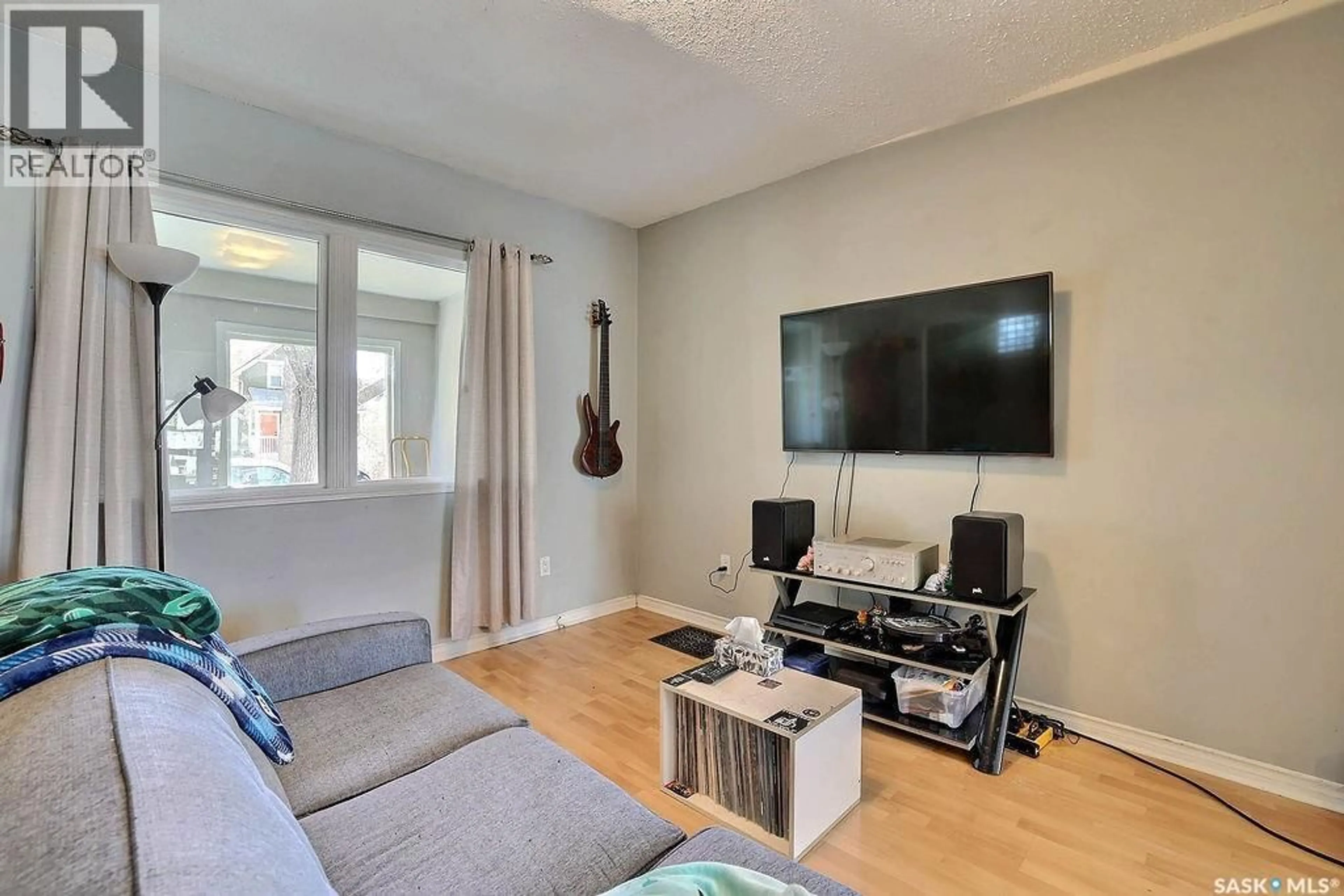 Living room with furniture, wood/laminate floor for 2066 WALLACE STREET, Regina Saskatchewan S4N4A4