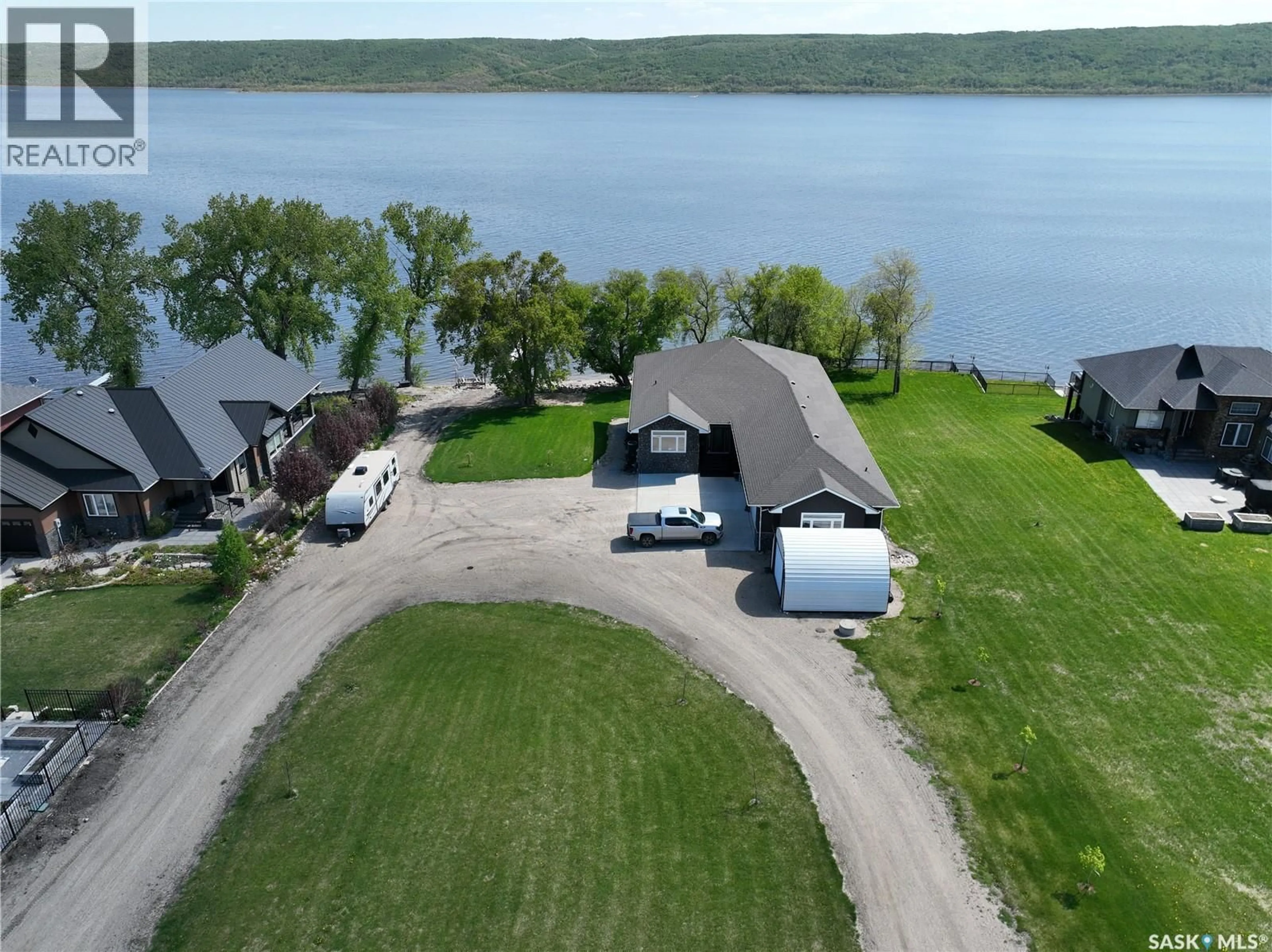A pic from outside/outdoor area/front of a property/back of a property/a pic from drone, water/lake/river/ocean view for 4 WHISPERING VALLEY ESTATES, Round Lake Saskatchewan S0A3Y0