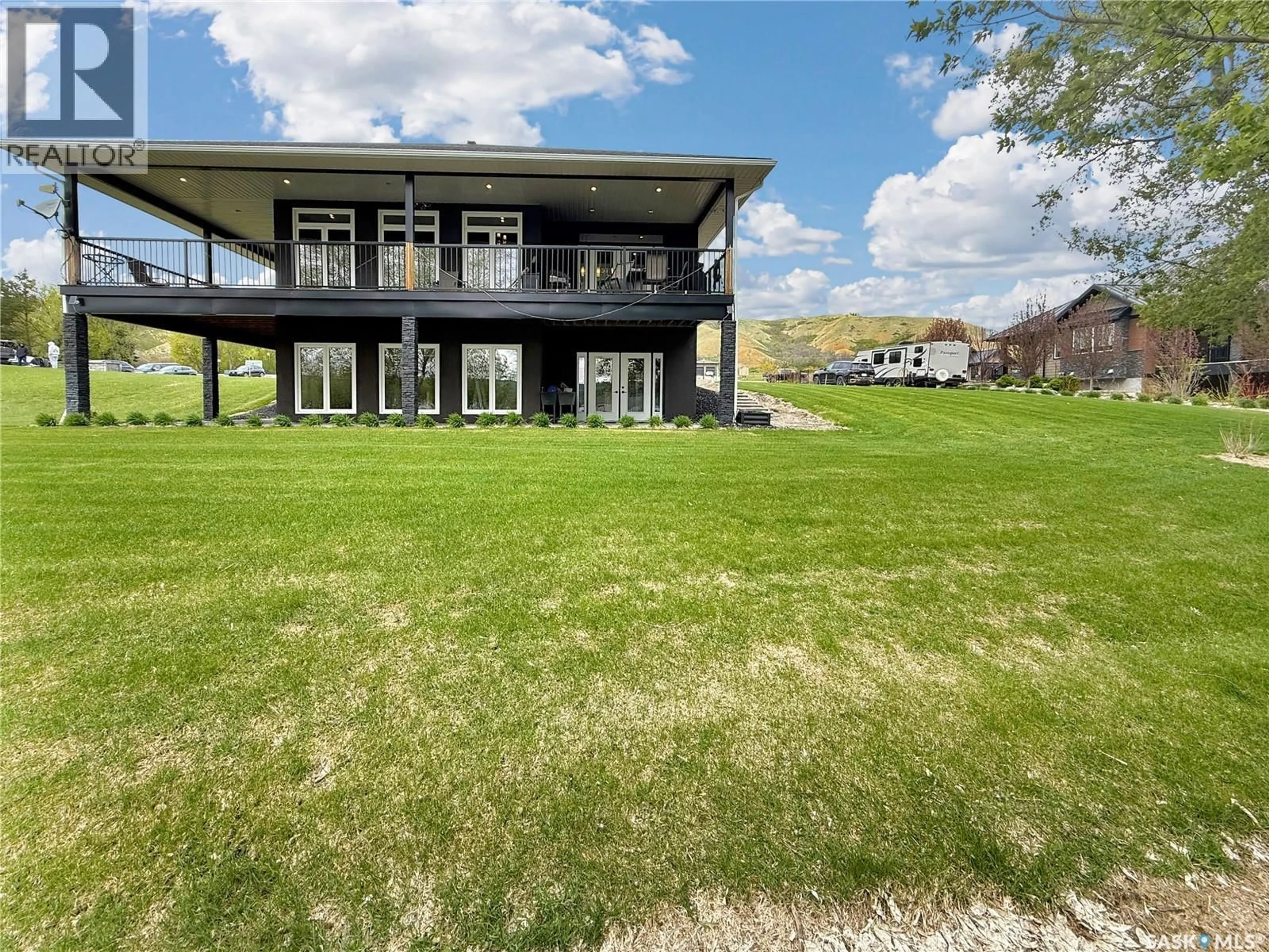 A pic from outside/outdoor area/front of a property/back of a property/a pic from drone, water/lake/river/ocean view for 4 WHISPERING VALLEY ESTATES, Round Lake Saskatchewan S0A3Y0