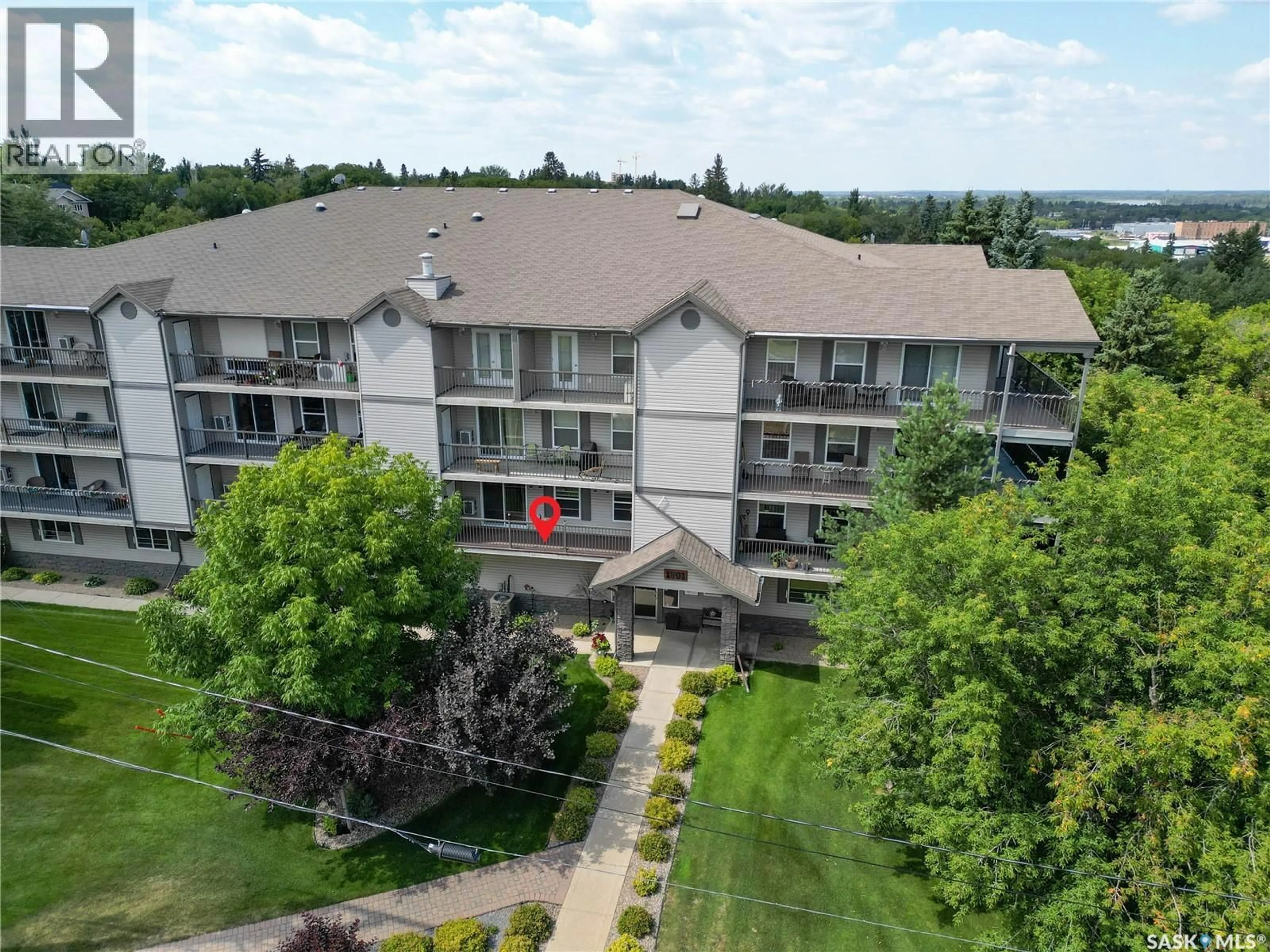 A pic from outside/outdoor area/front of a property/back of a property/a pic from drone, unknown for 1 1/2 - 201 1901 1 AVENUE W, Prince Albert Saskatchewan S6V5A8