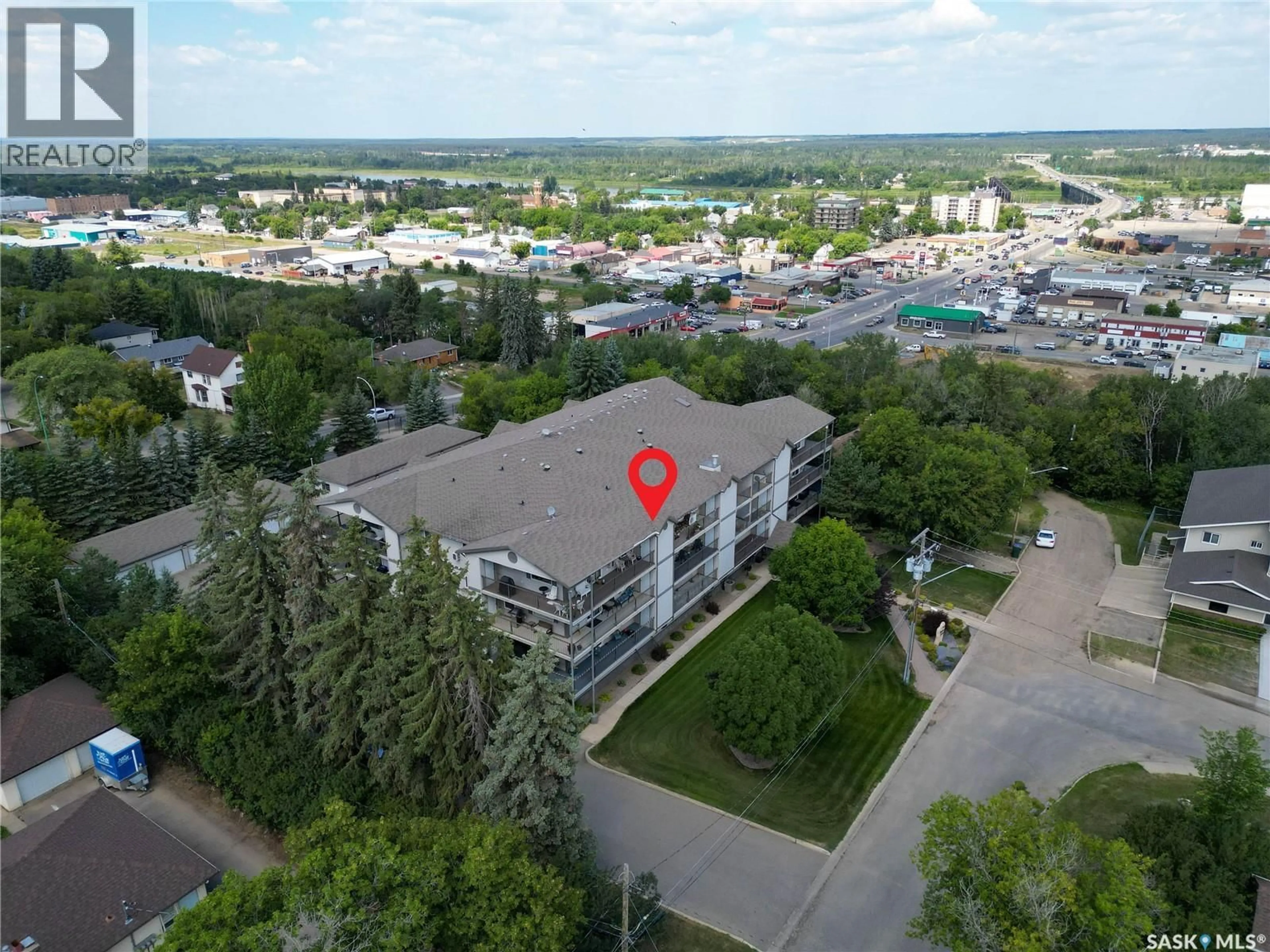 A pic from outside/outdoor area/front of a property/back of a property/a pic from drone, unknown for 1 1/2 - 201 1901 1 AVENUE W, Prince Albert Saskatchewan S6V5A8